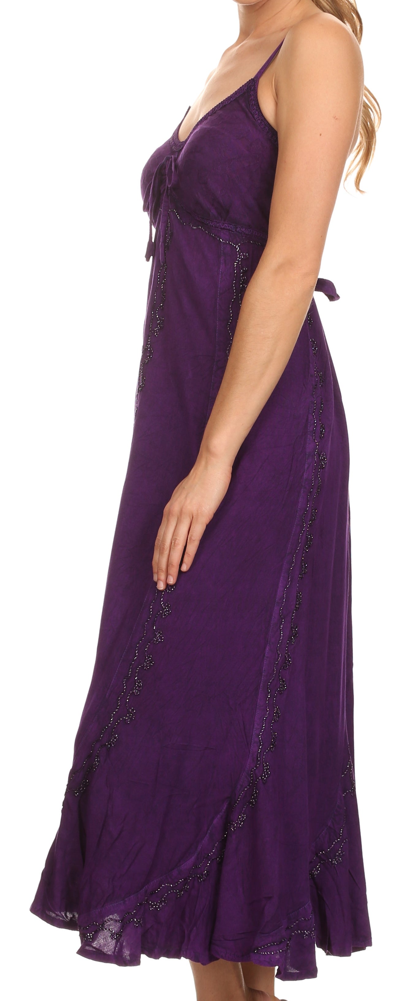Purple dress with lace details on a model against a white background