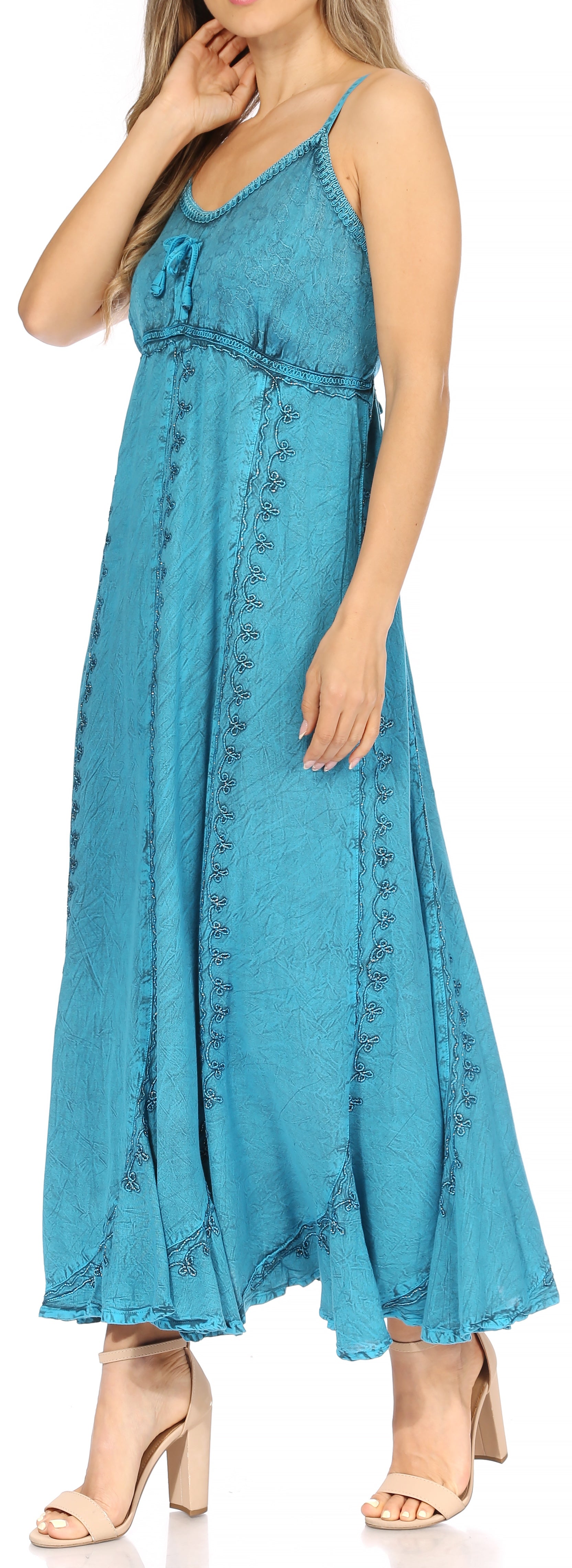 Woman wearing a blue denim dress with lace details.