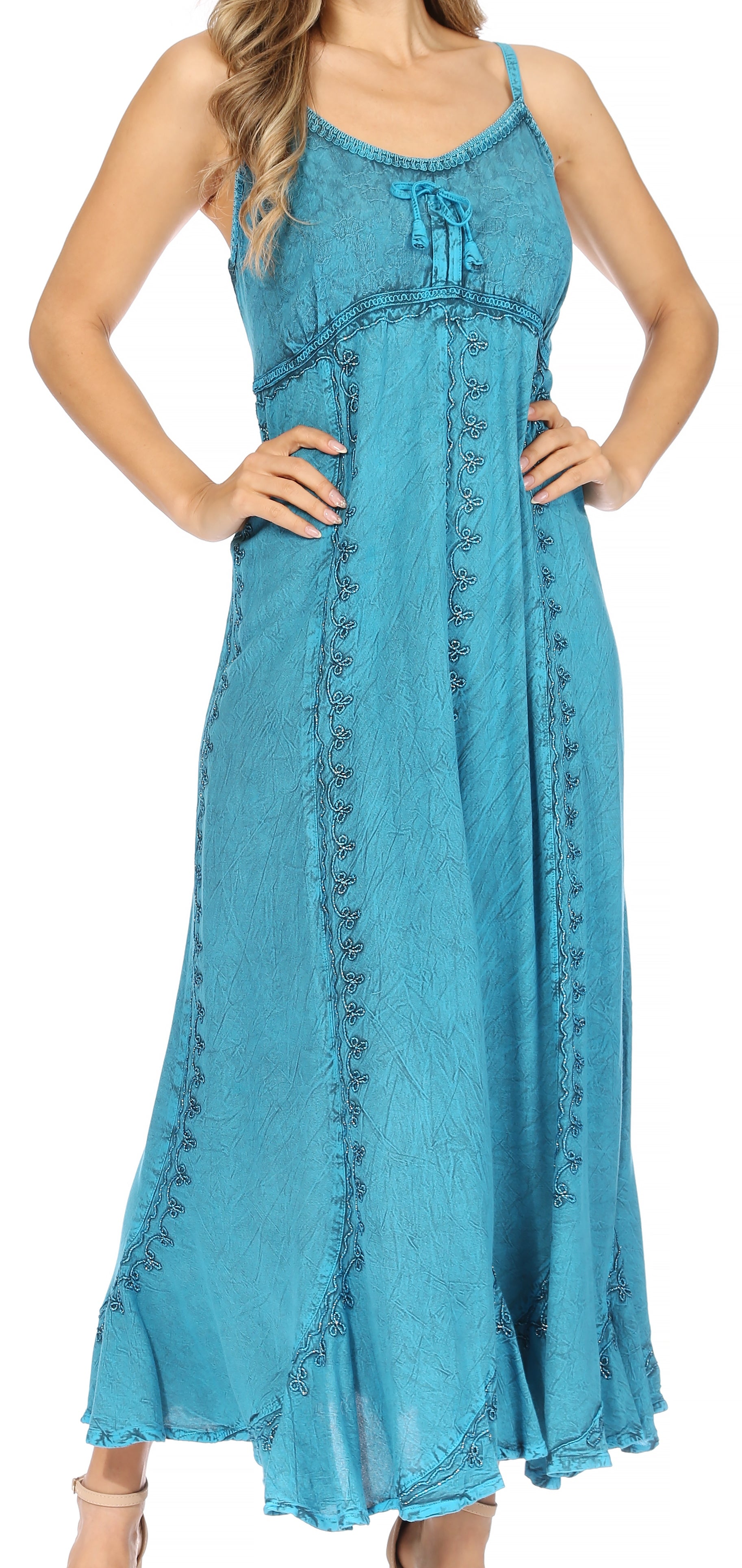 Woman wearing a blue dress with embroidery on a white background