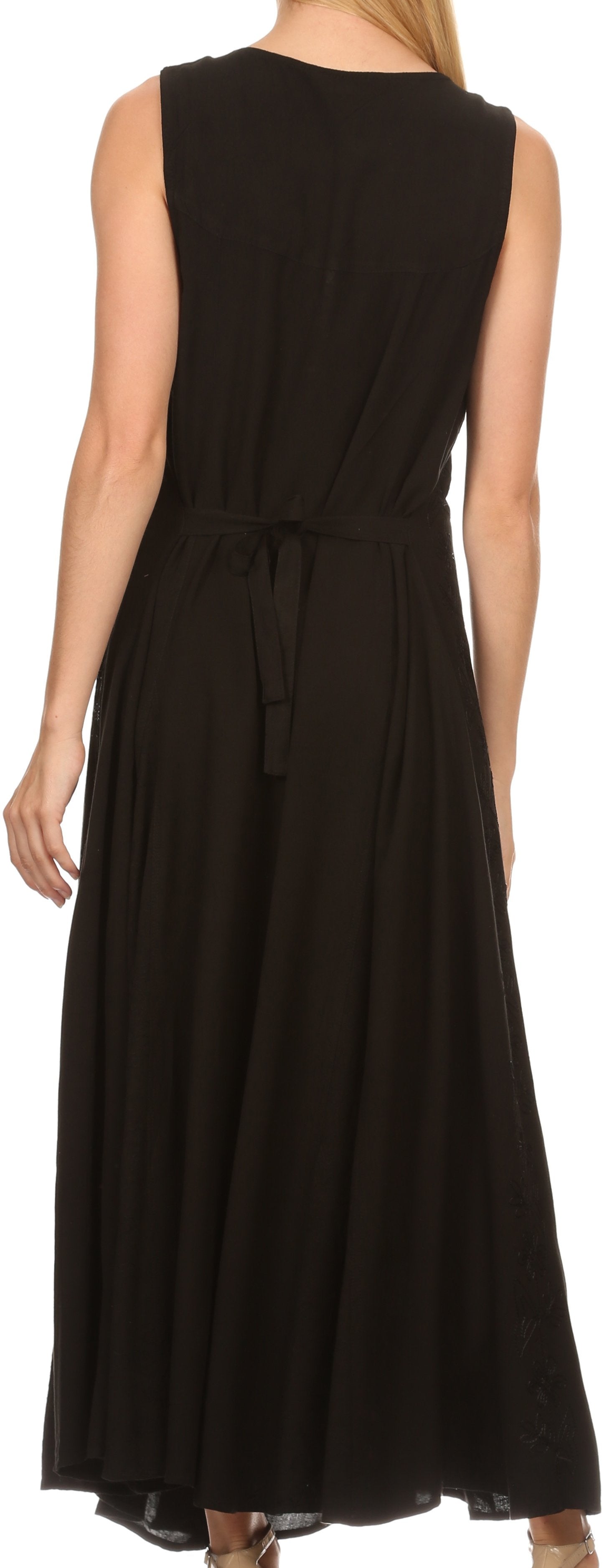 Black sleeveless dress with a belt on a model against a neutral background
