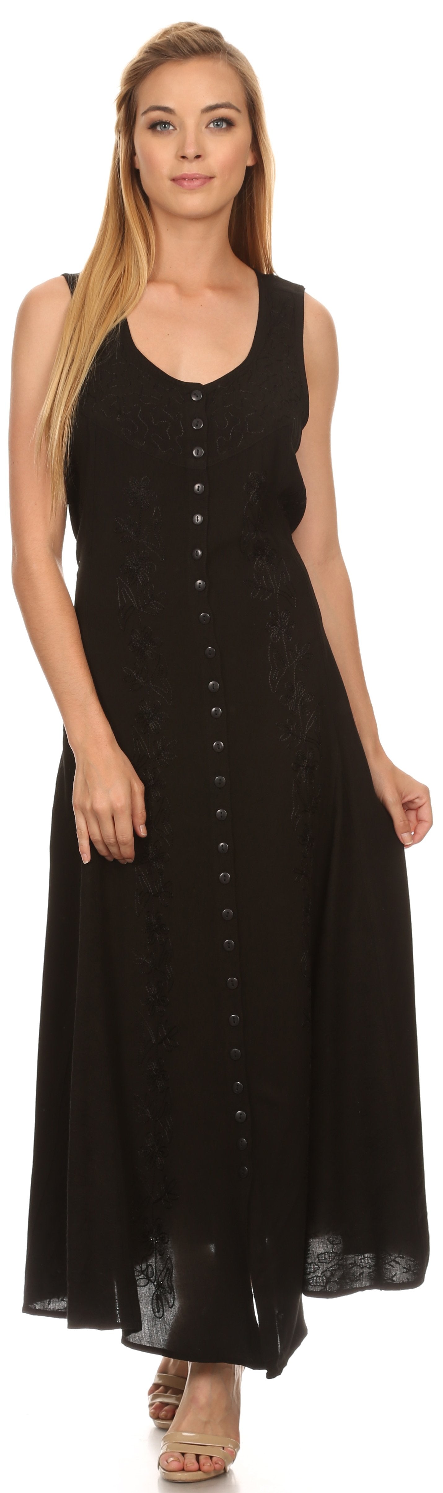 Woman wearing a black sleeveless dress with buttons on a white background
