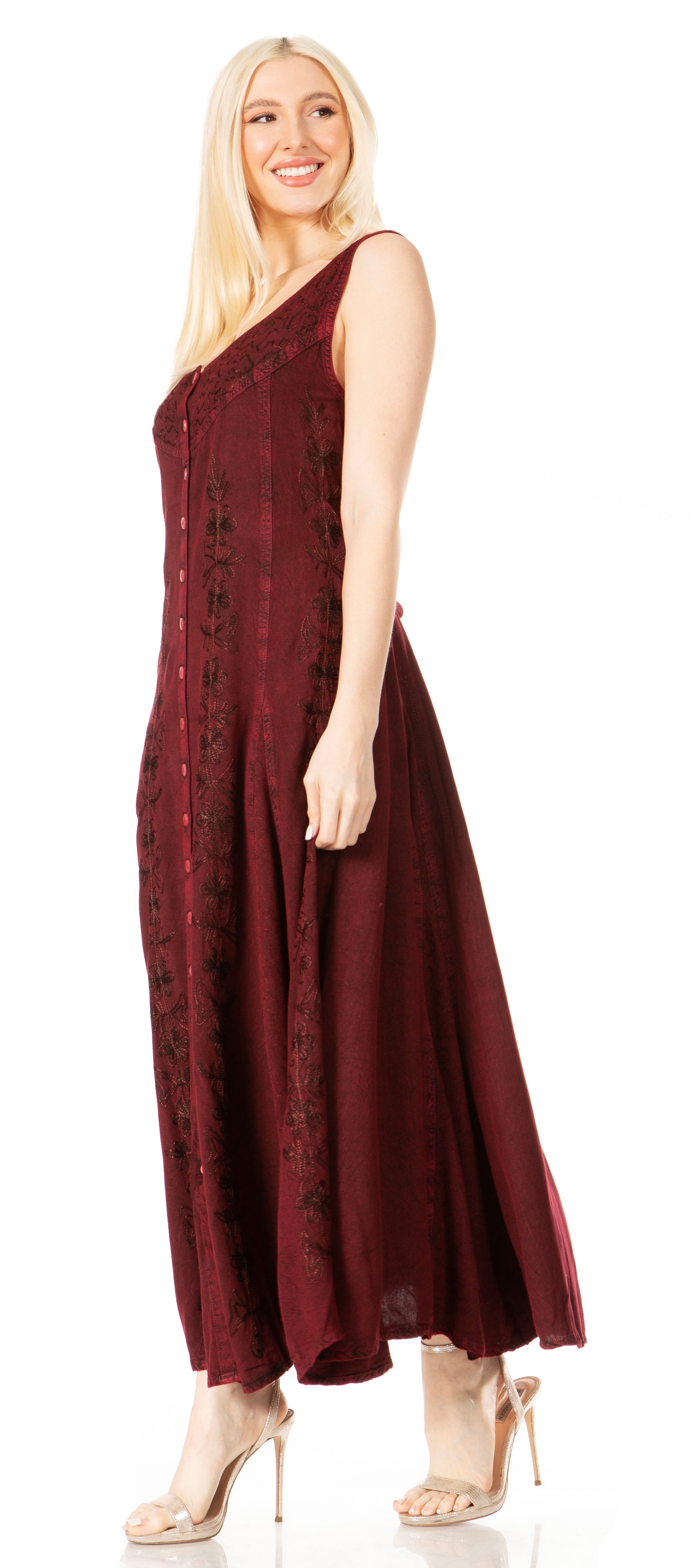Woman wearing a burgundy one-shoulder dress on a white background