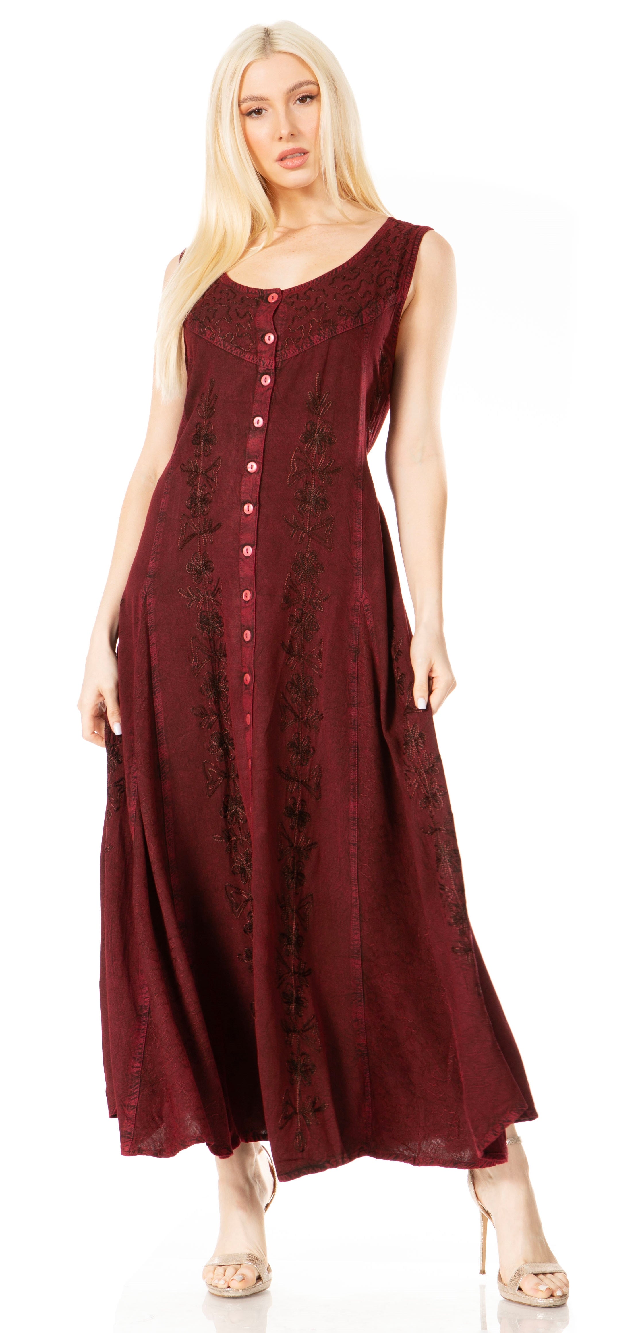 Woman wearing a burgundy dress with lace details on a white background