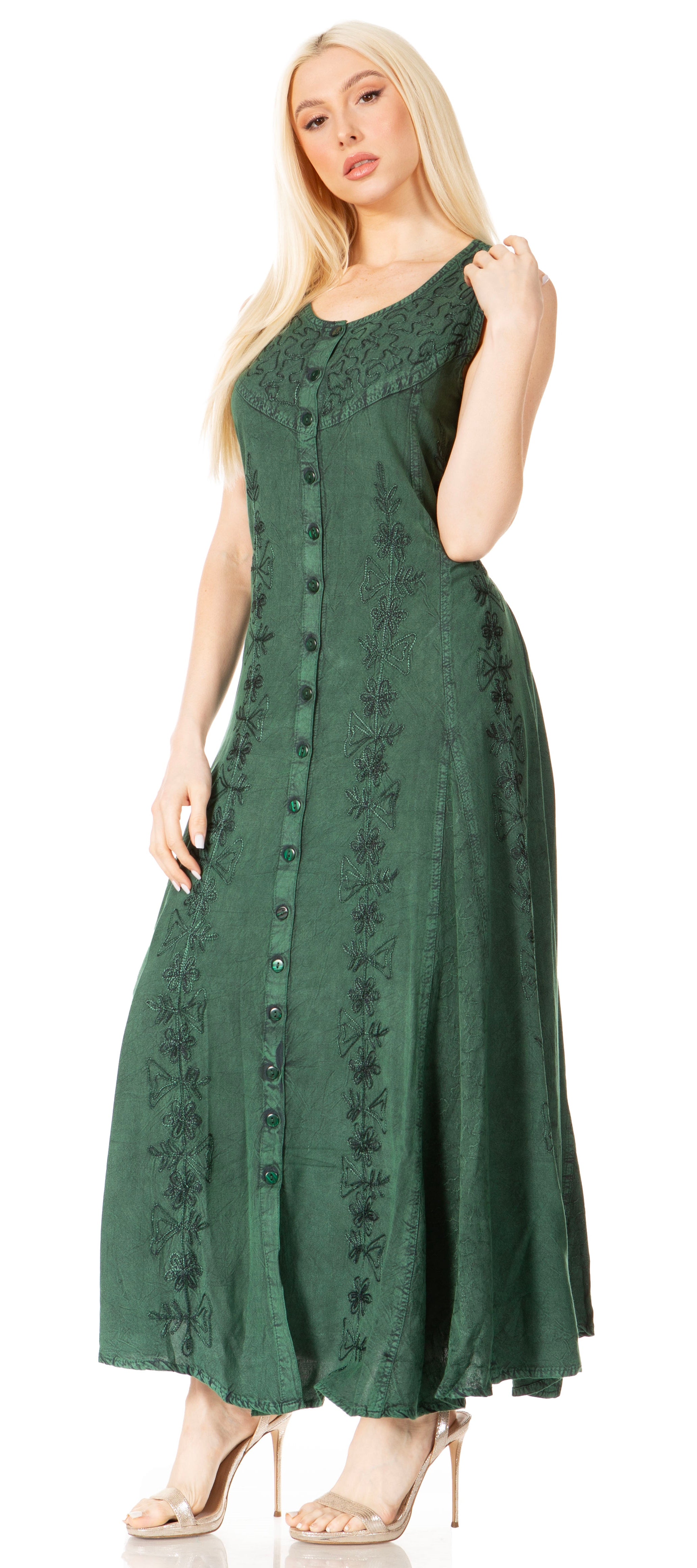 Woman wearing a green dress with a pattern on a white background