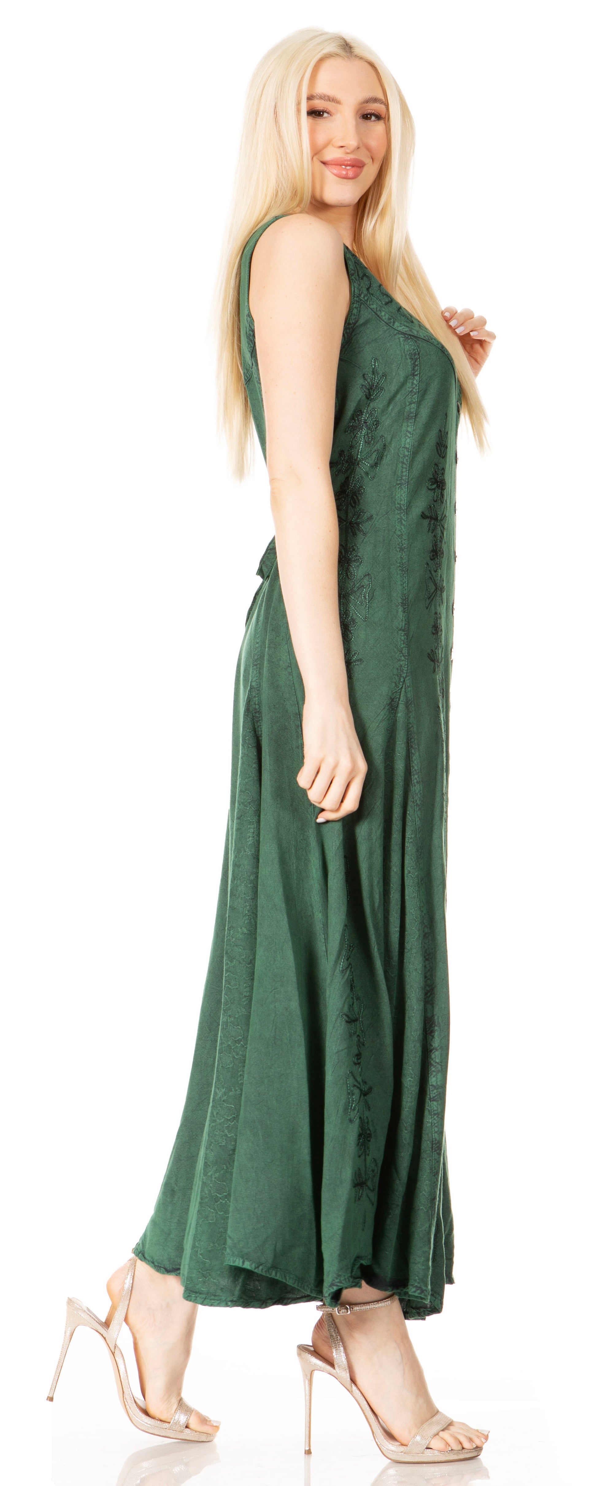 Woman wearing a green sleeveless dress on a white background