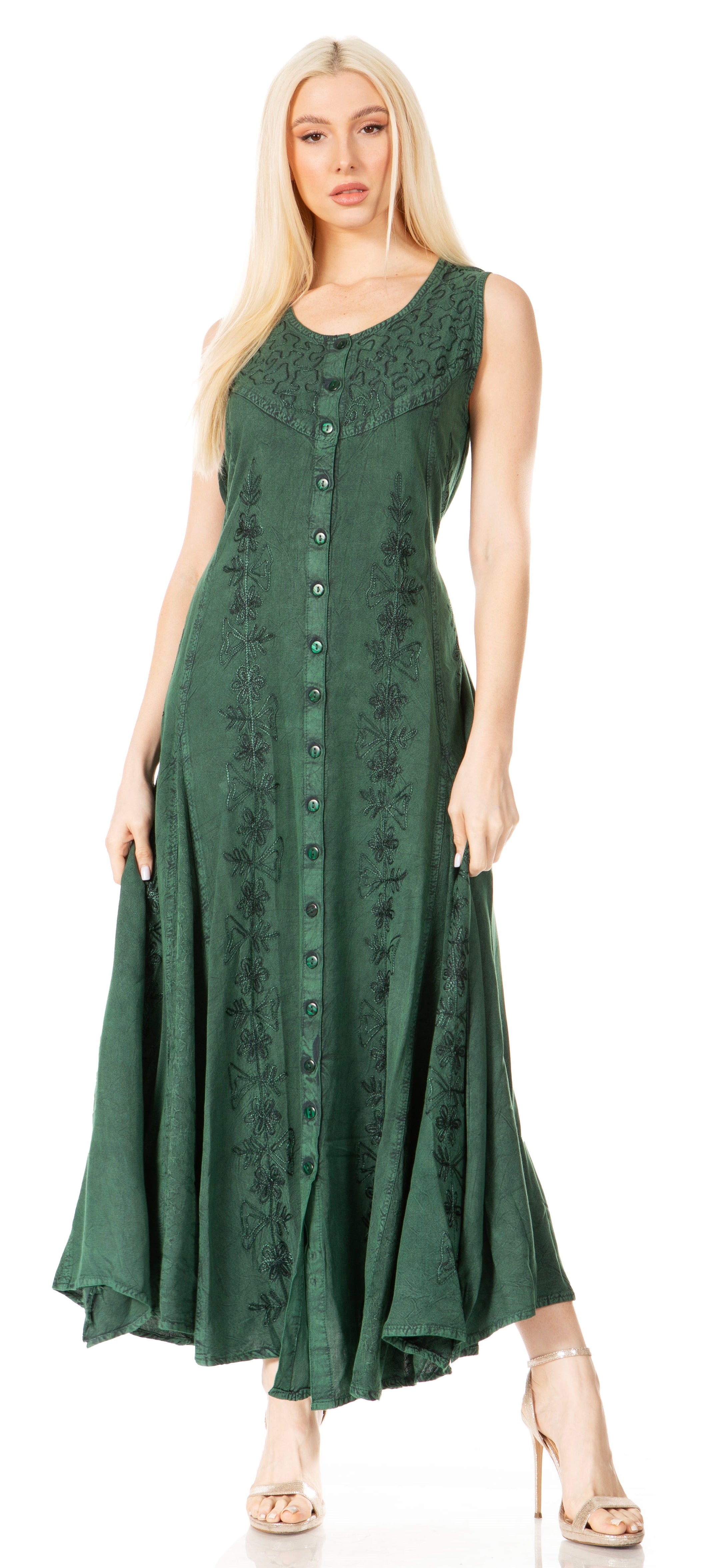 Woman wearing a green sleeveless dress with lace details on a white background