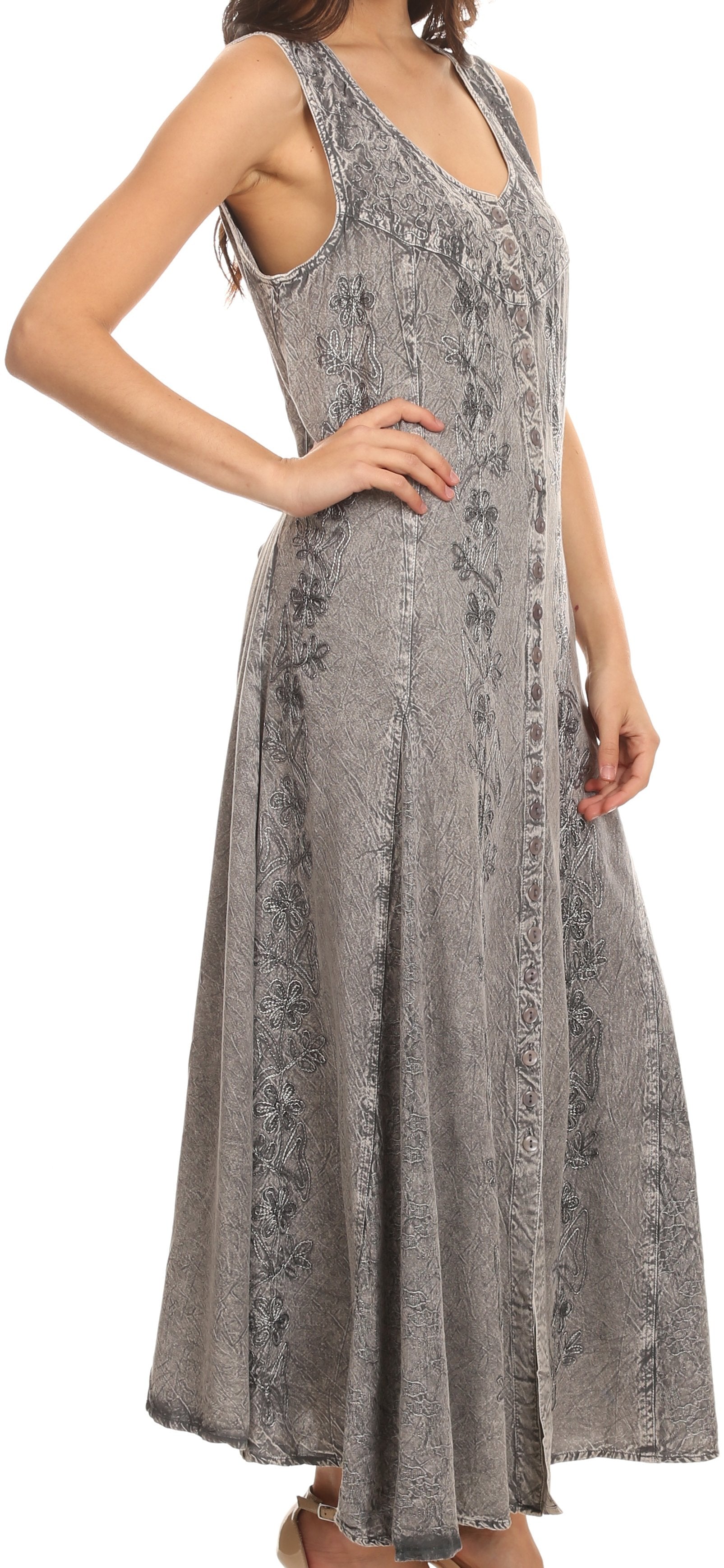 Woman wearing a gray patterned dress on a white background