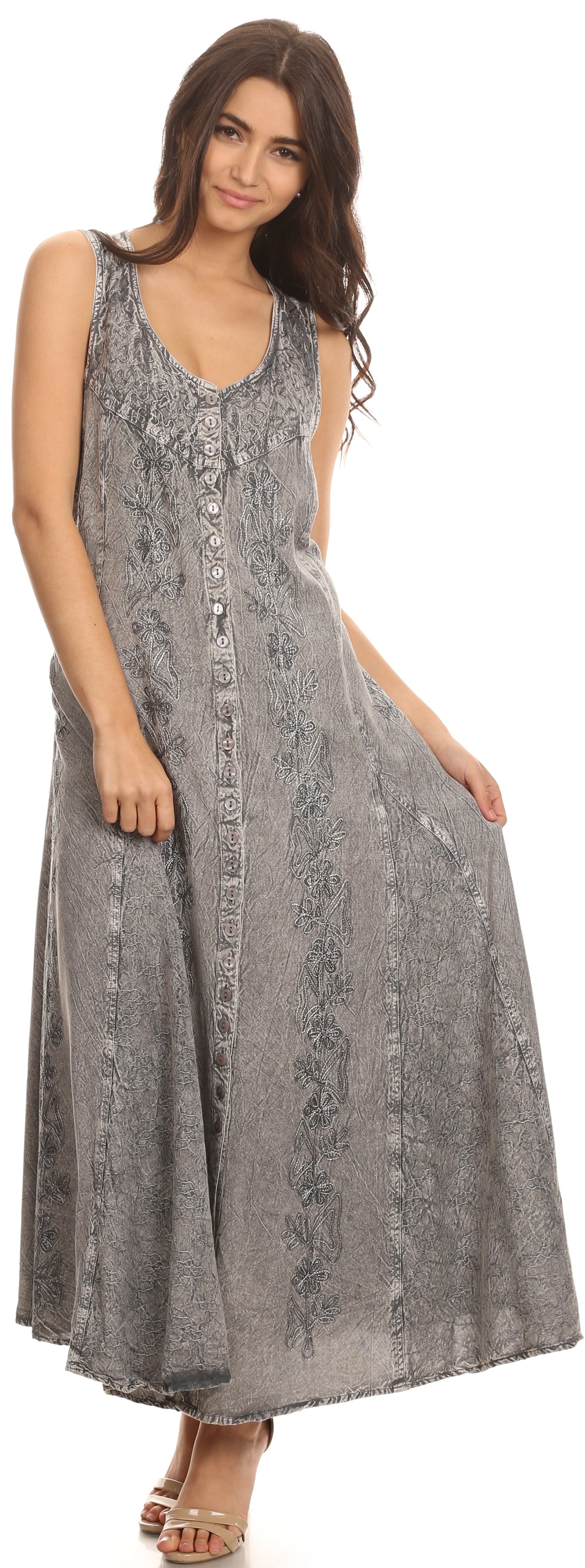 Woman wearing a long, patterned dress on a white background