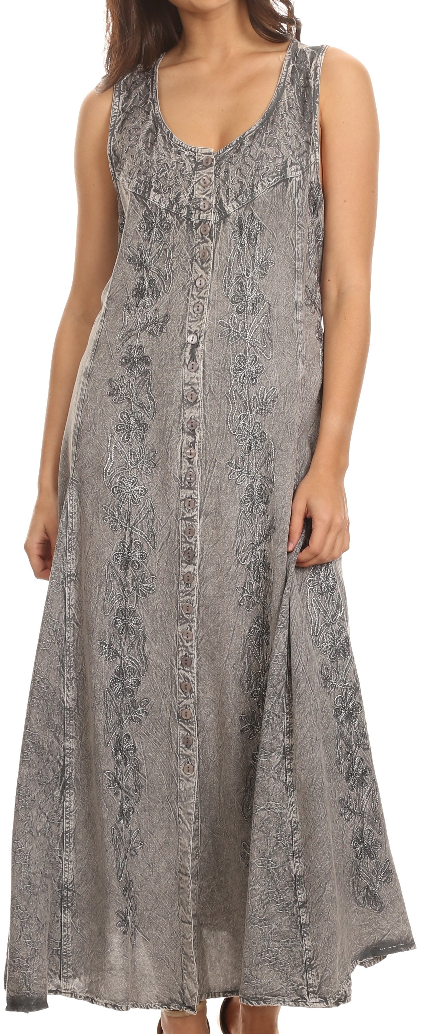 Woman wearing a long, patterned dress against a neutral background