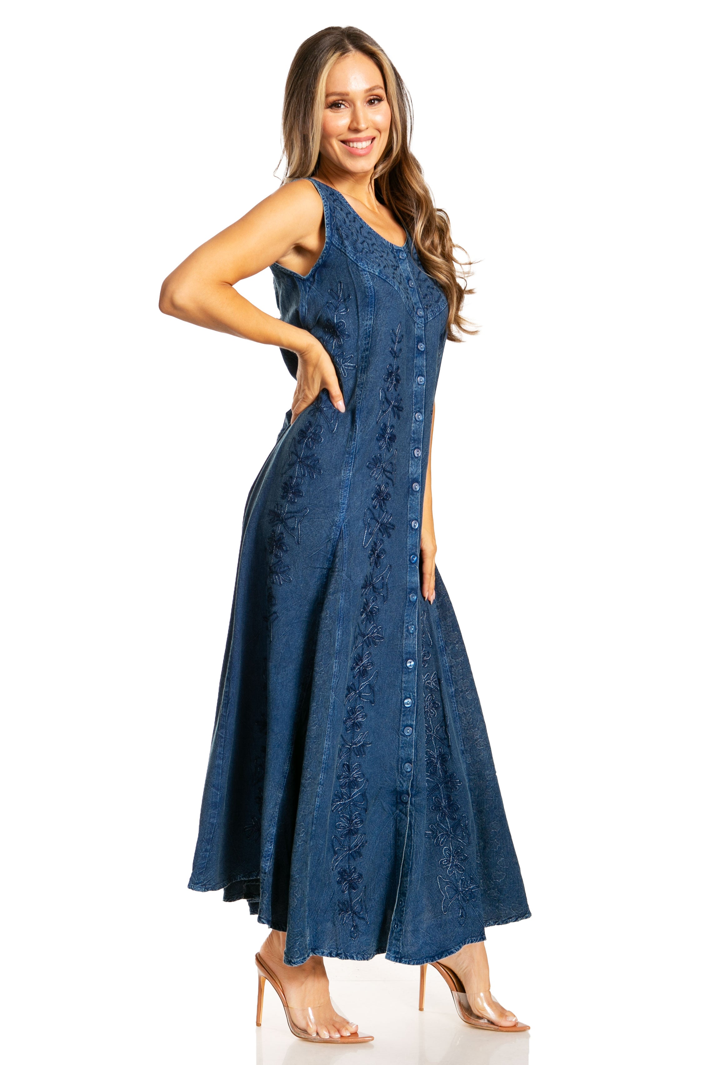 Woman wearing a blue dress with floral patterns on a white background