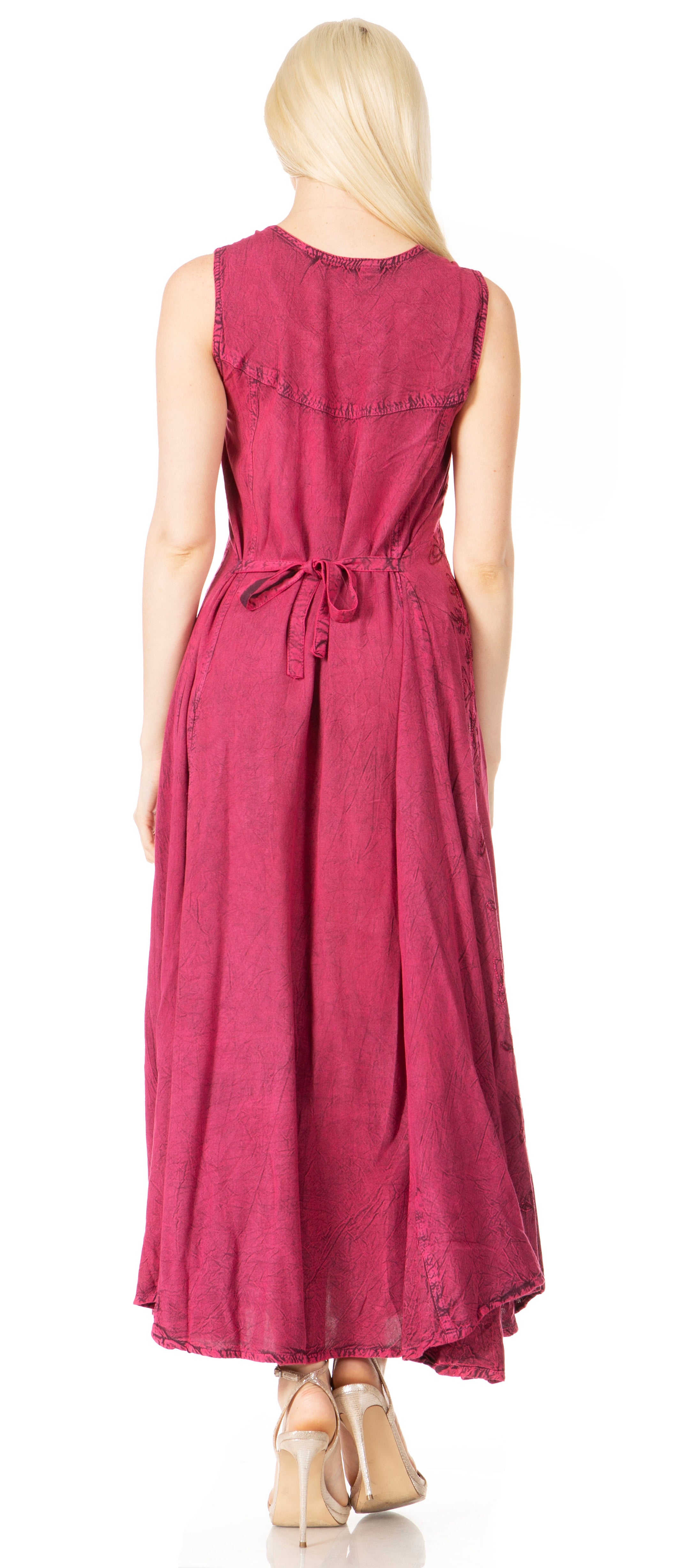 Woman wearing a pink sleeveless dress on a white background