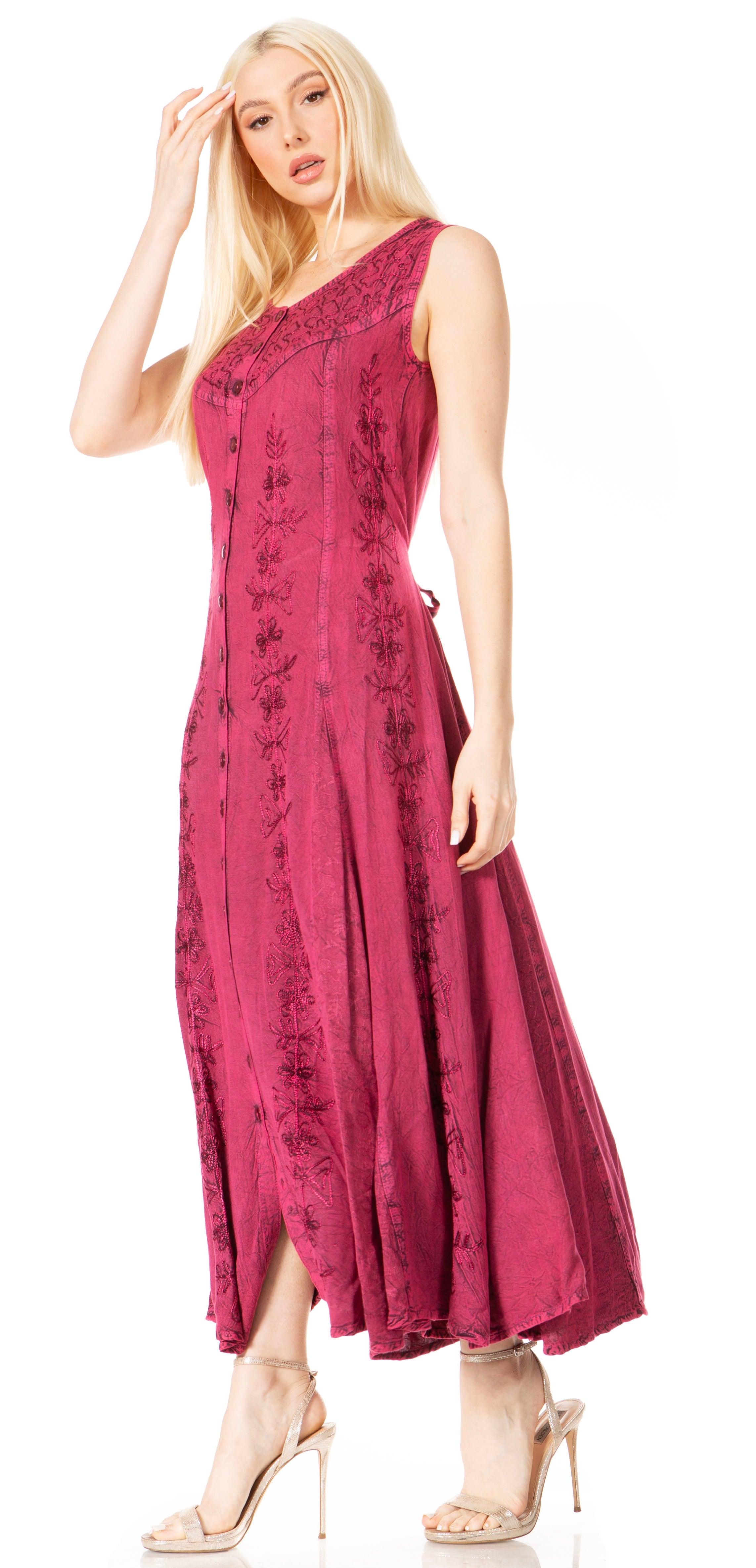 Woman wearing a pink dress with floral patterns on a white background