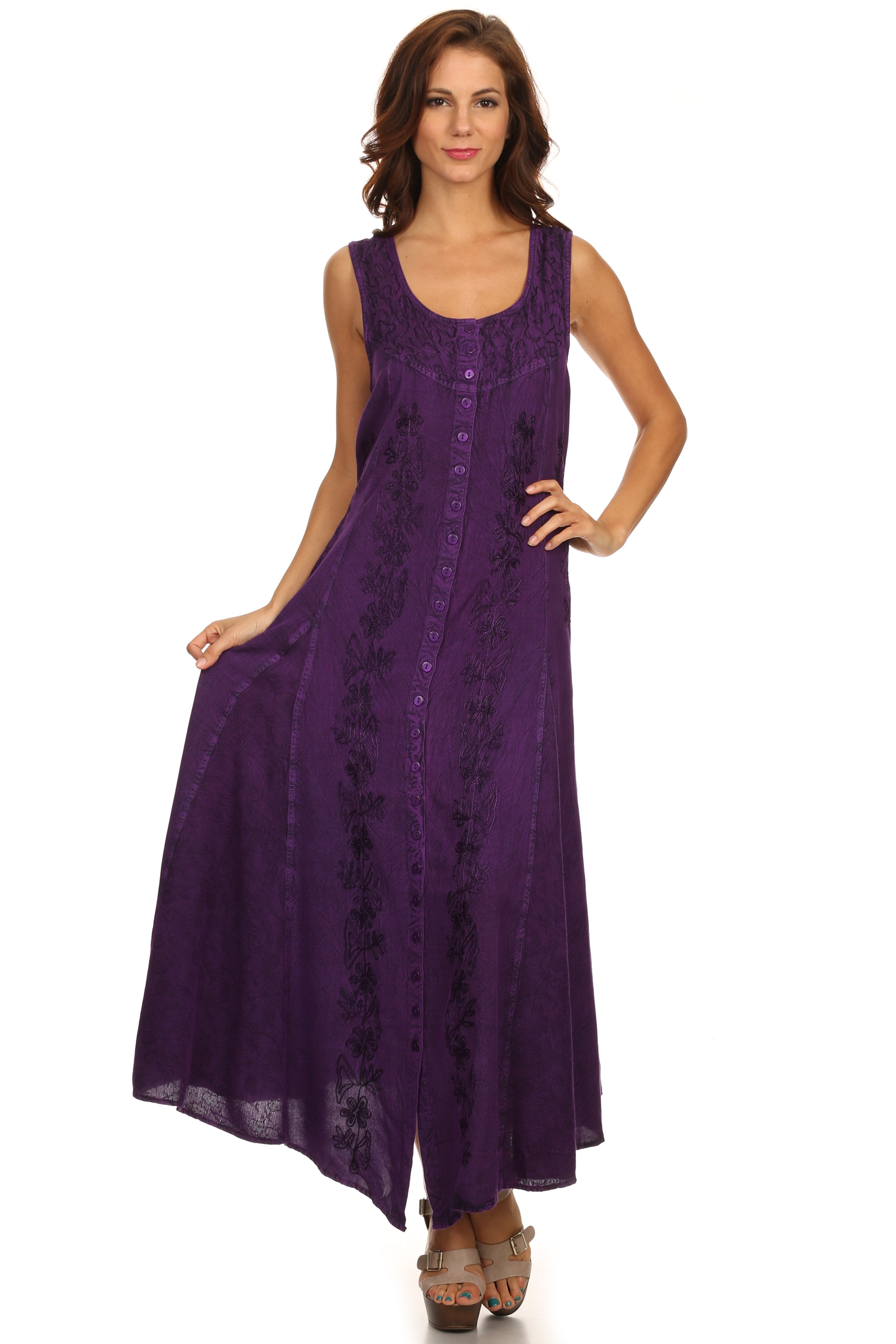 Woman wearing a purple sleeveless dress on a white background