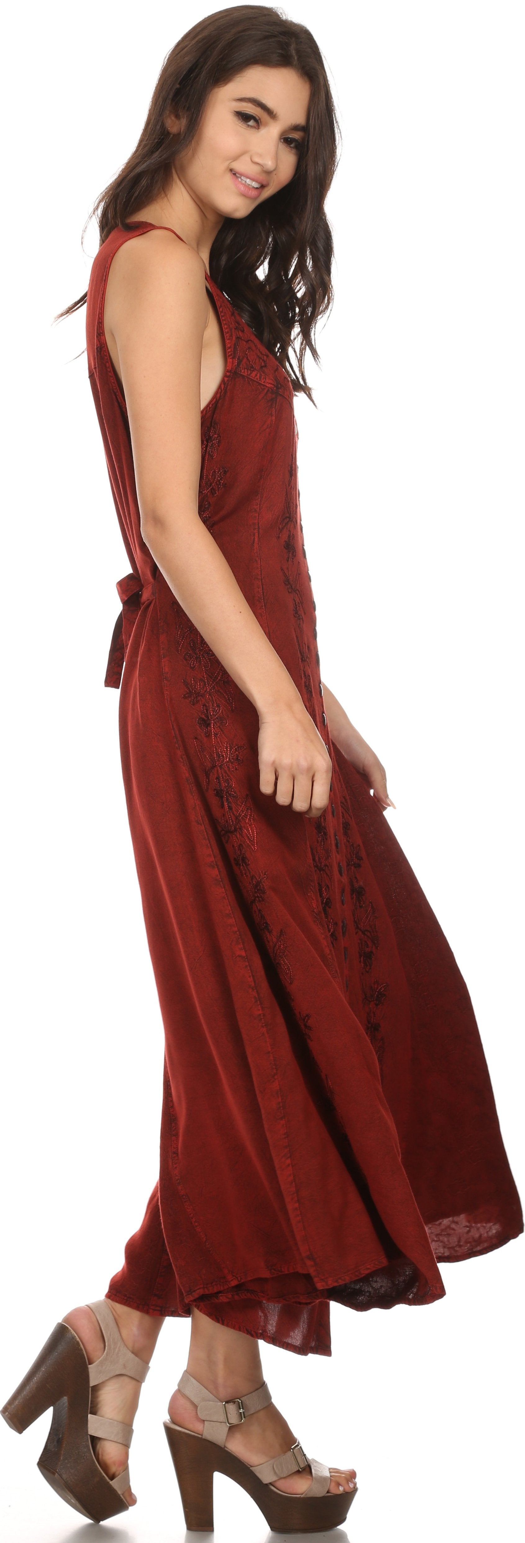 Woman wearing a burgundy dress on a white background