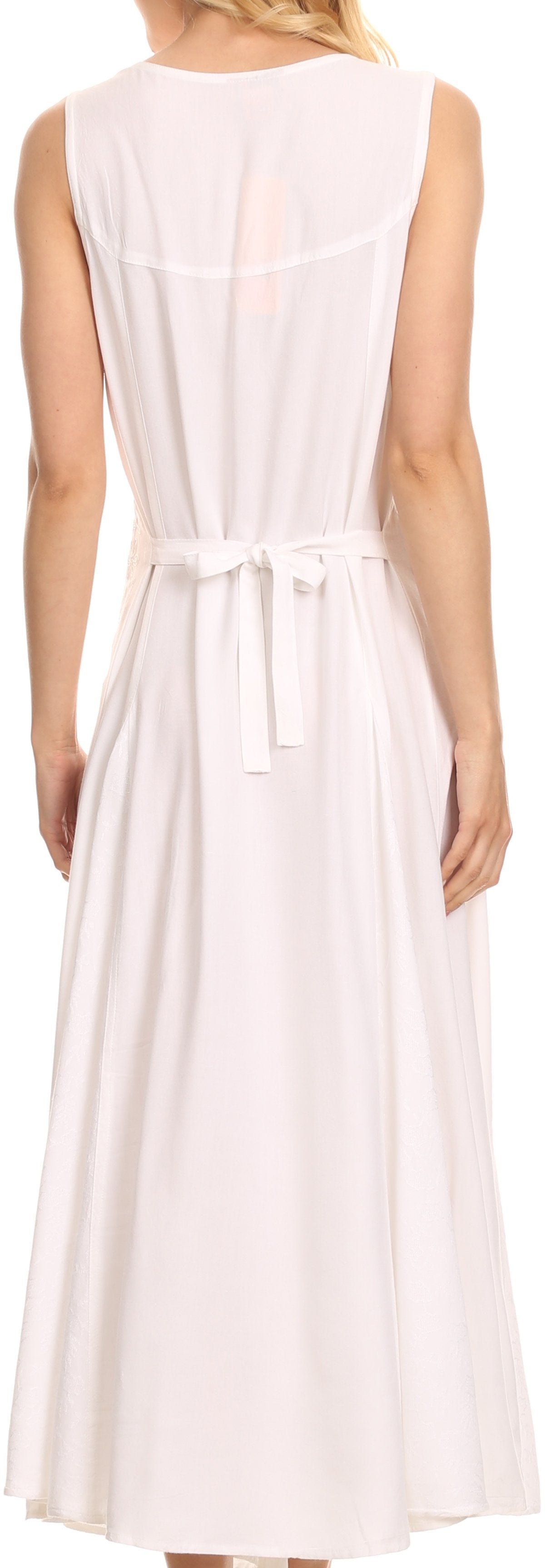 Woman wearing a long white dress with a belt
