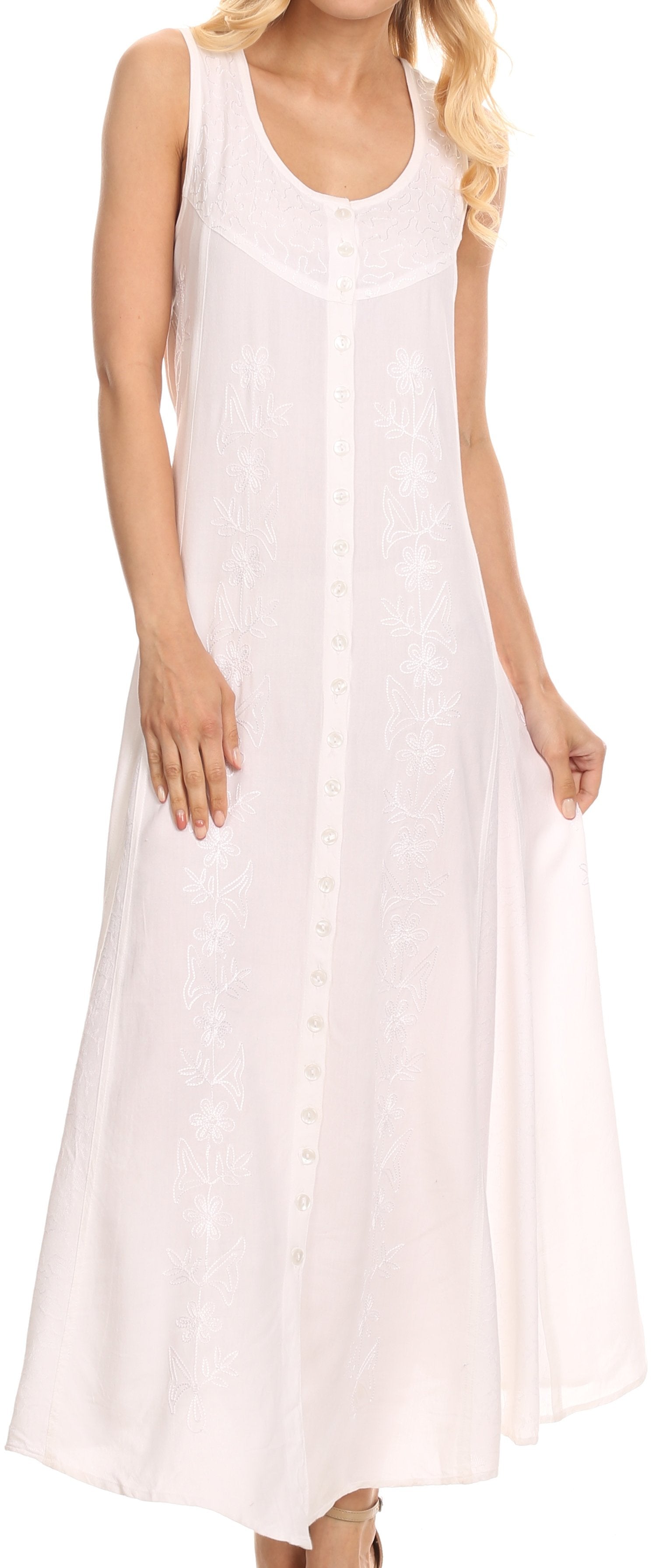 White sleeveless dress worn by a person with blonde hair.