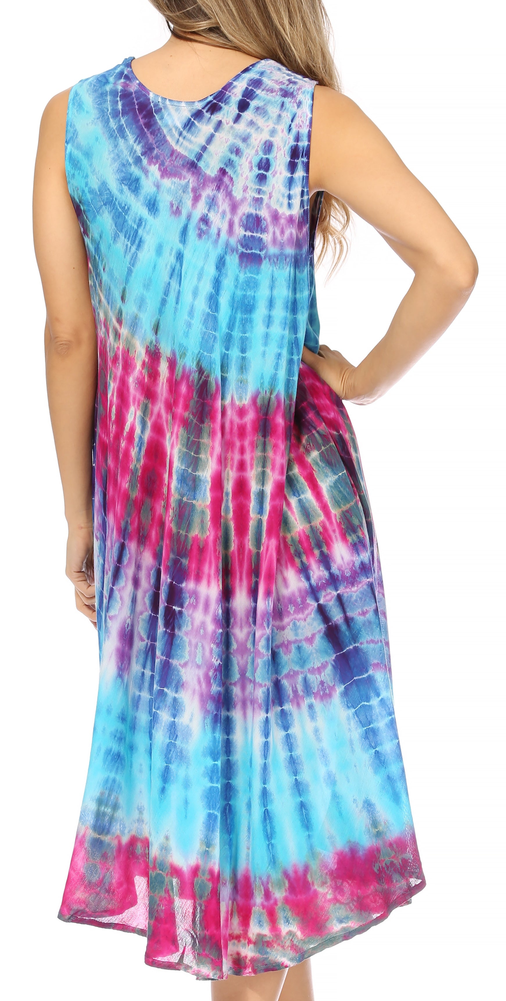 Woman wearing a tie-dye dress with pink, blue, and purple colors on a white background