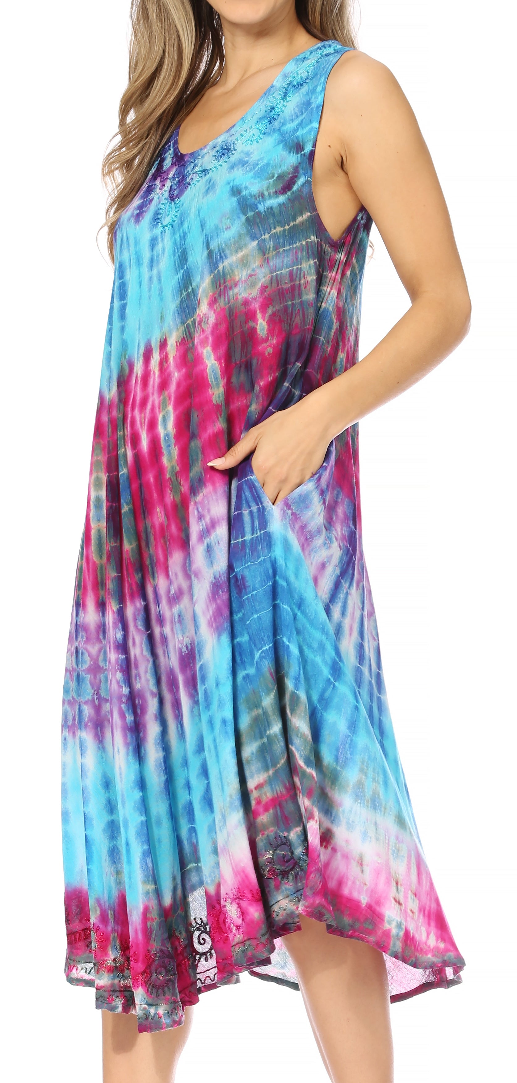 Multicolored tie-dye dress worn by a model on a white background
