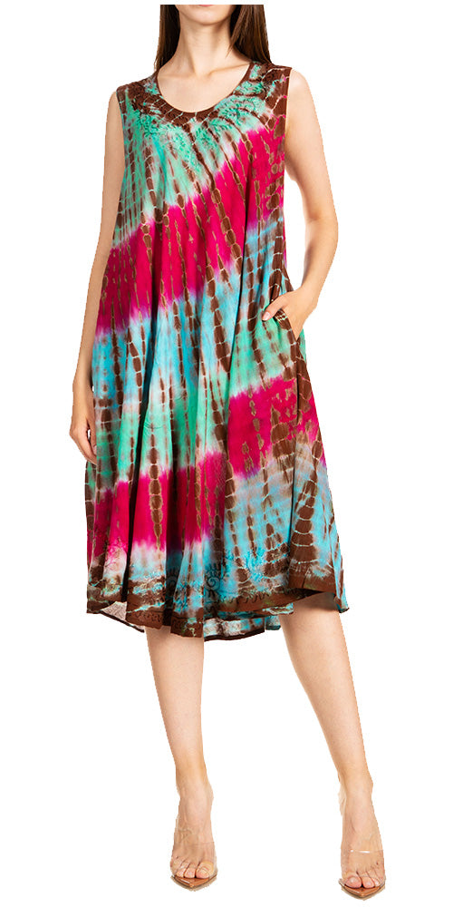 Woman wearing a tie-dye dress with pink and blue patterns on a white background