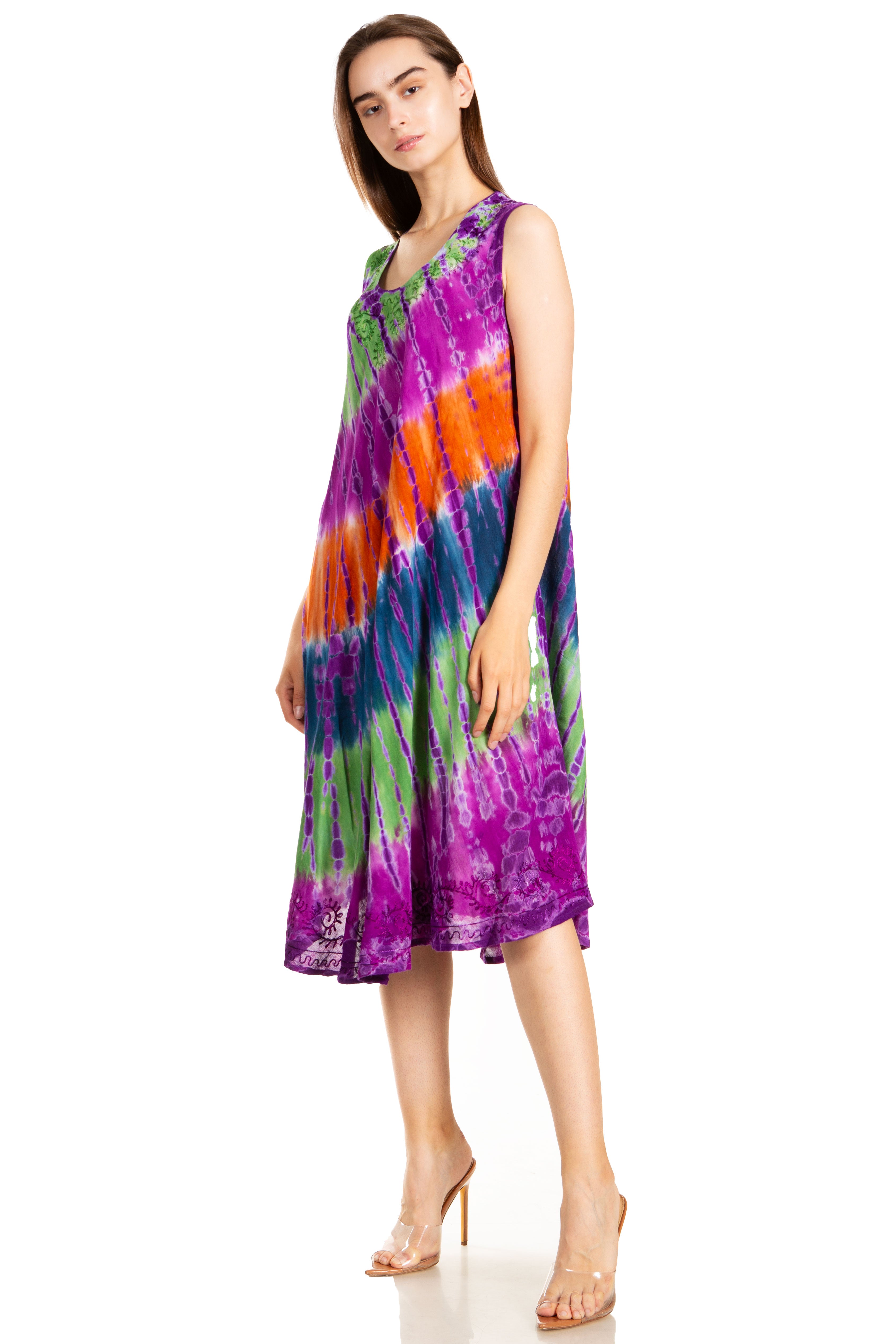 Woman wearing a tie-dye dress on a white background