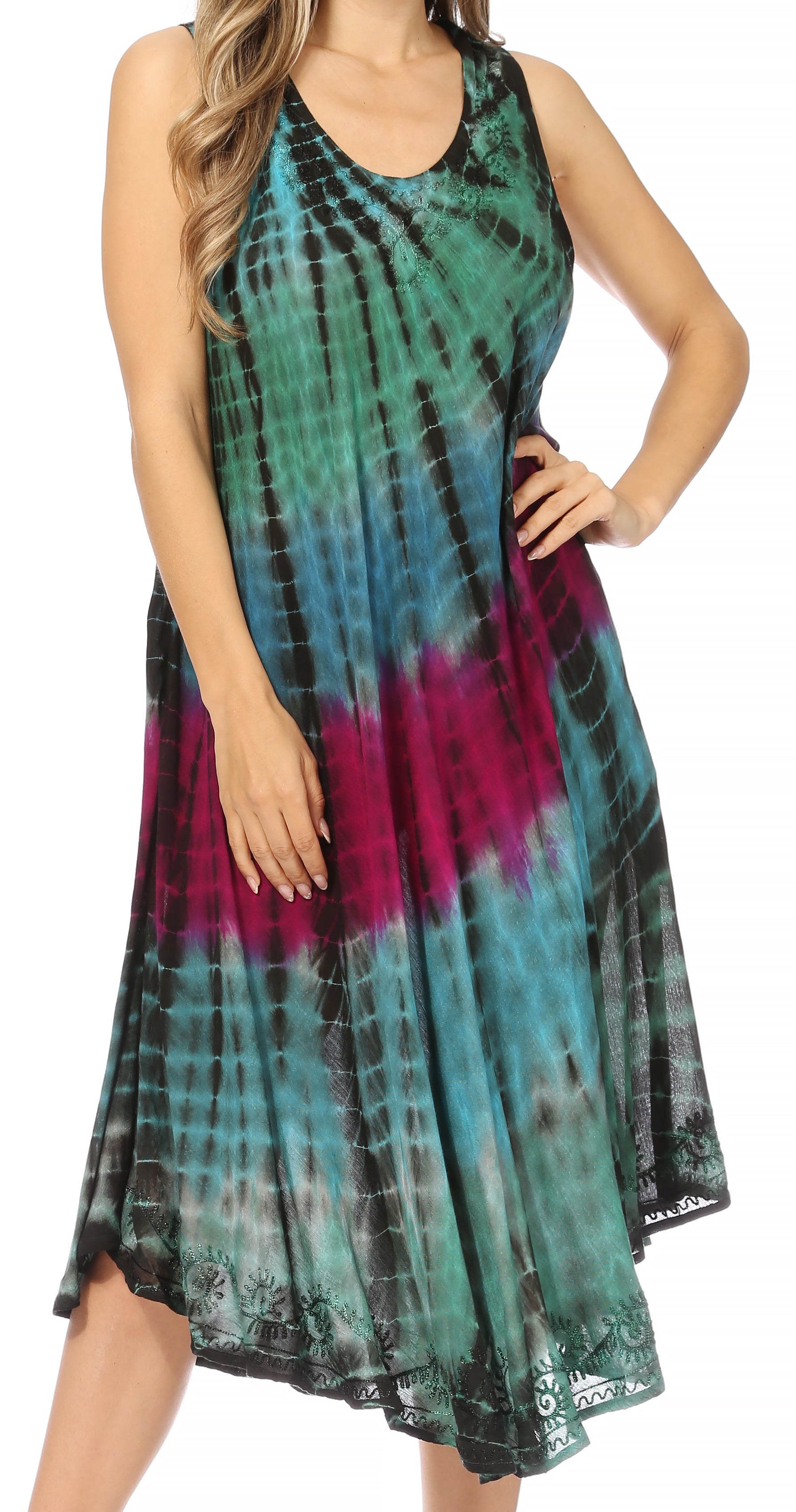 Woman wearing a tie-dye dress with a colorful pattern on a white background