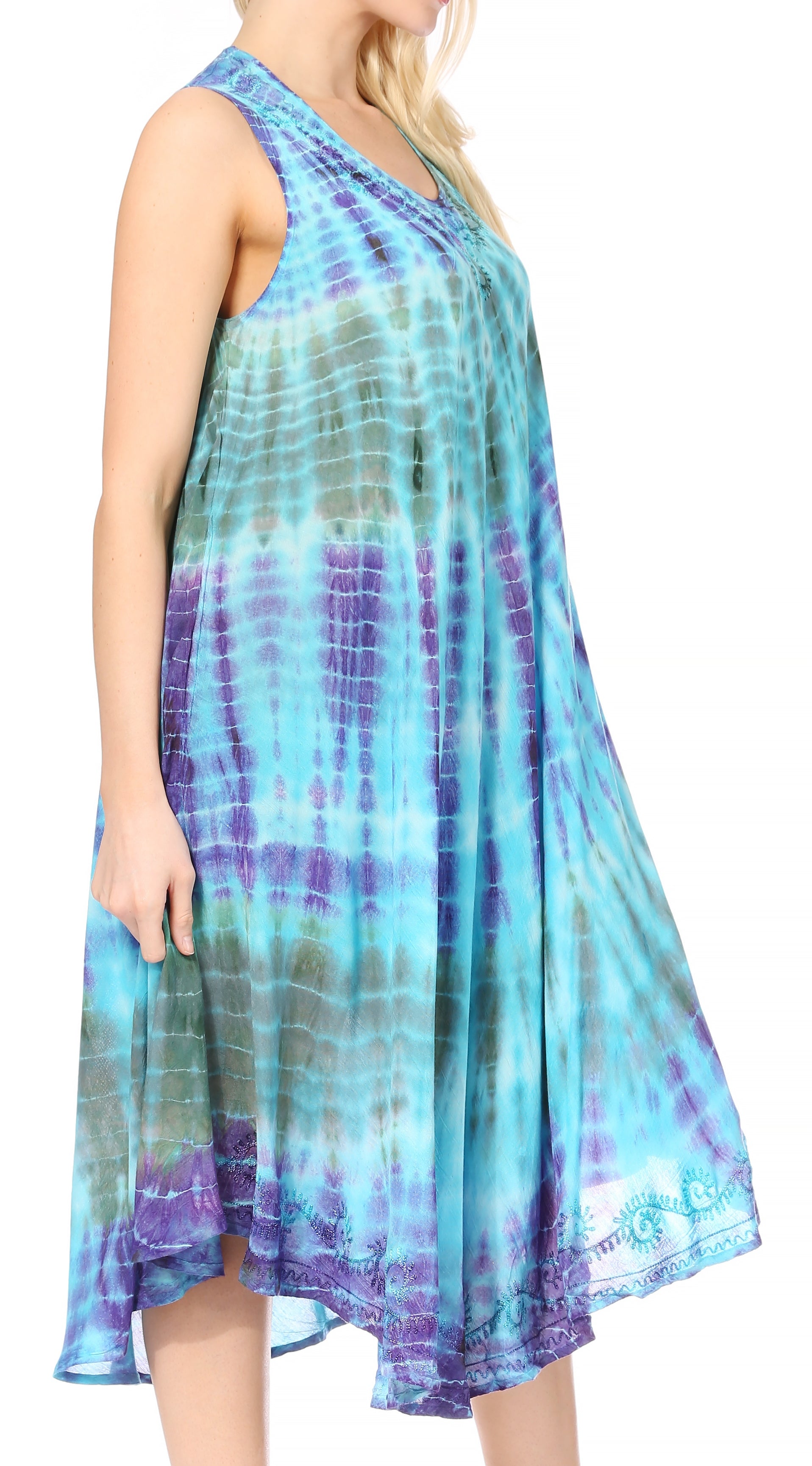 Woman wearing a tie-dye dress with blue and purple hues on a white background