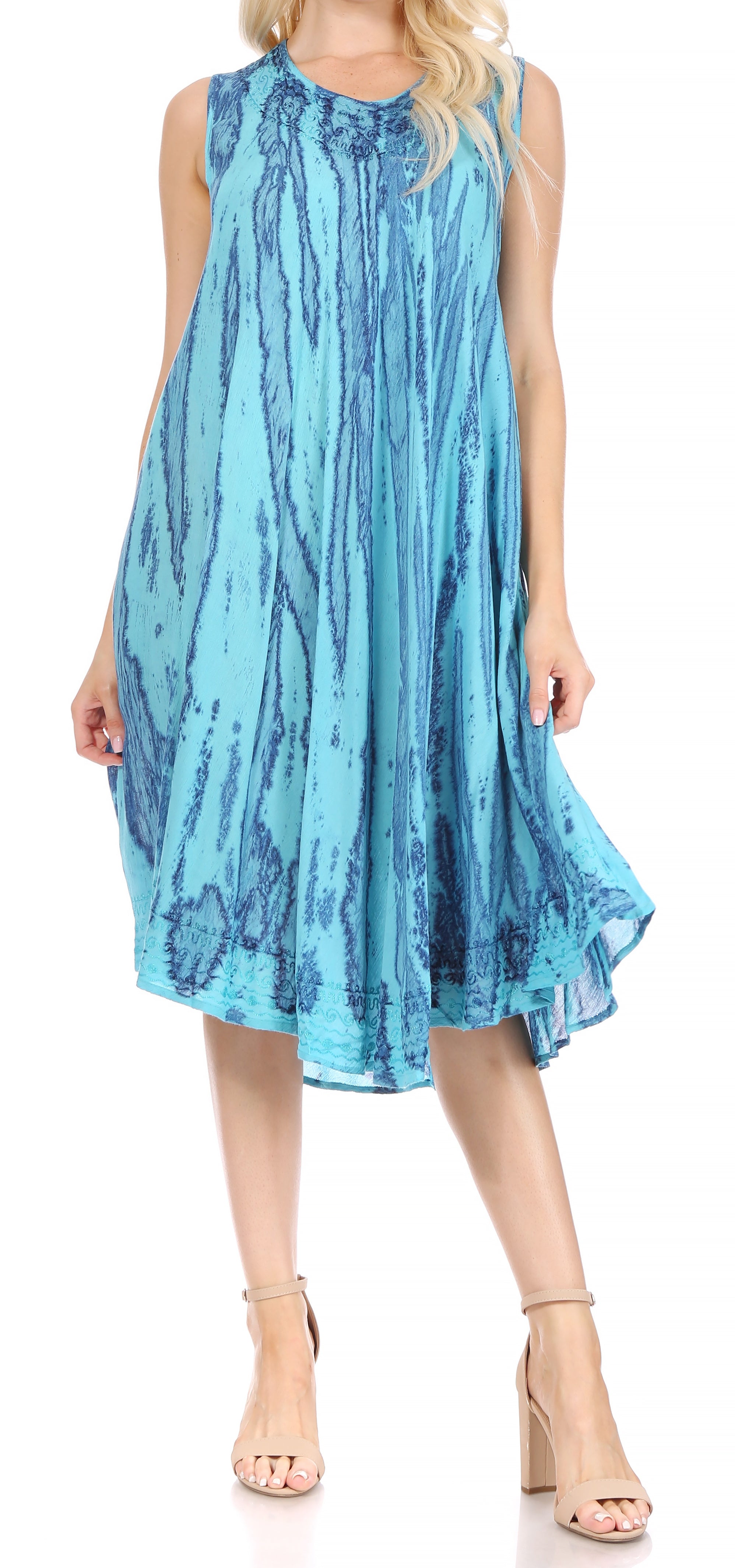 Woman wearing a blue tie-dye dress on a white background