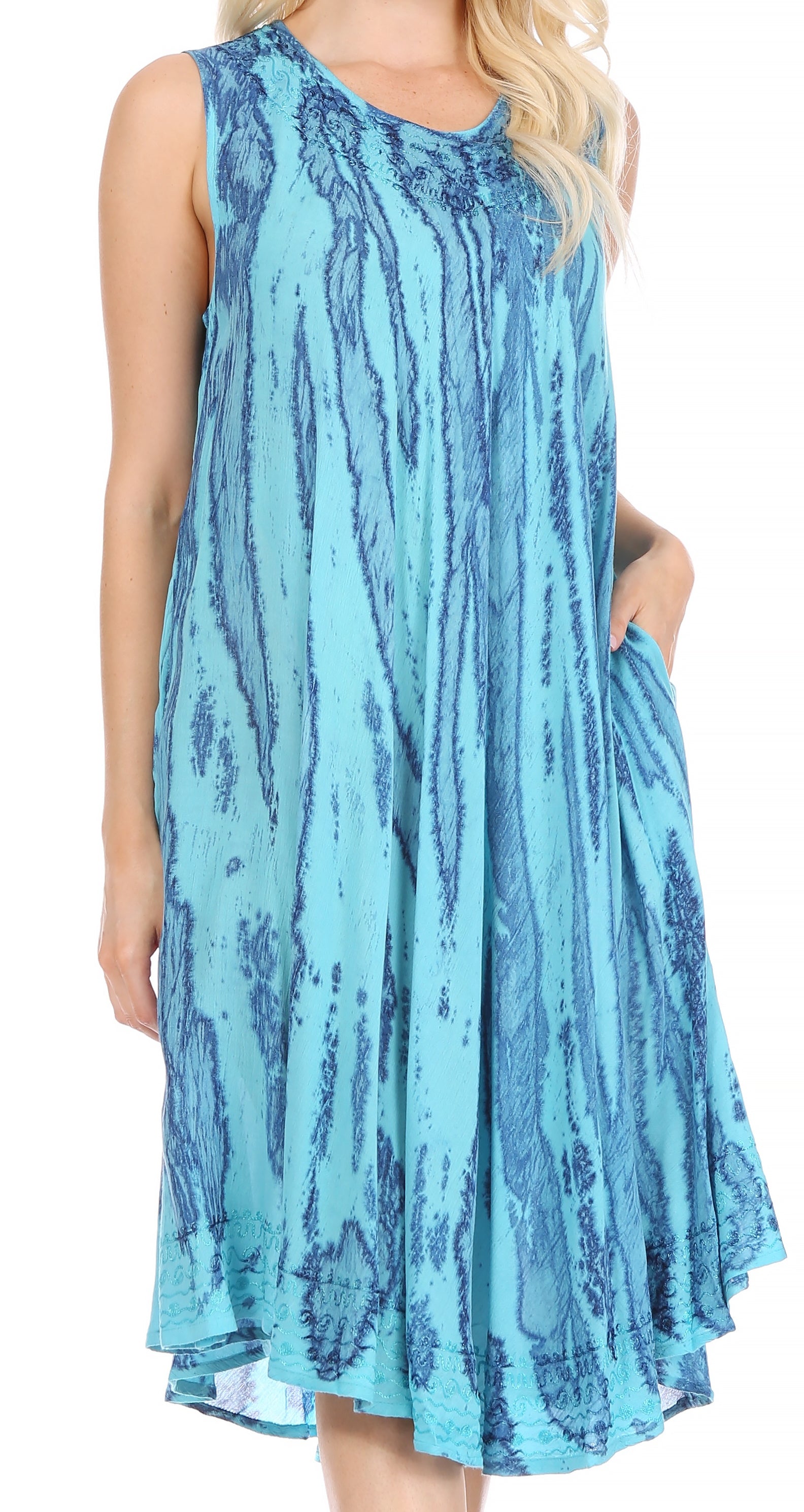 Woman wearing a blue tie-dye dress on a white background