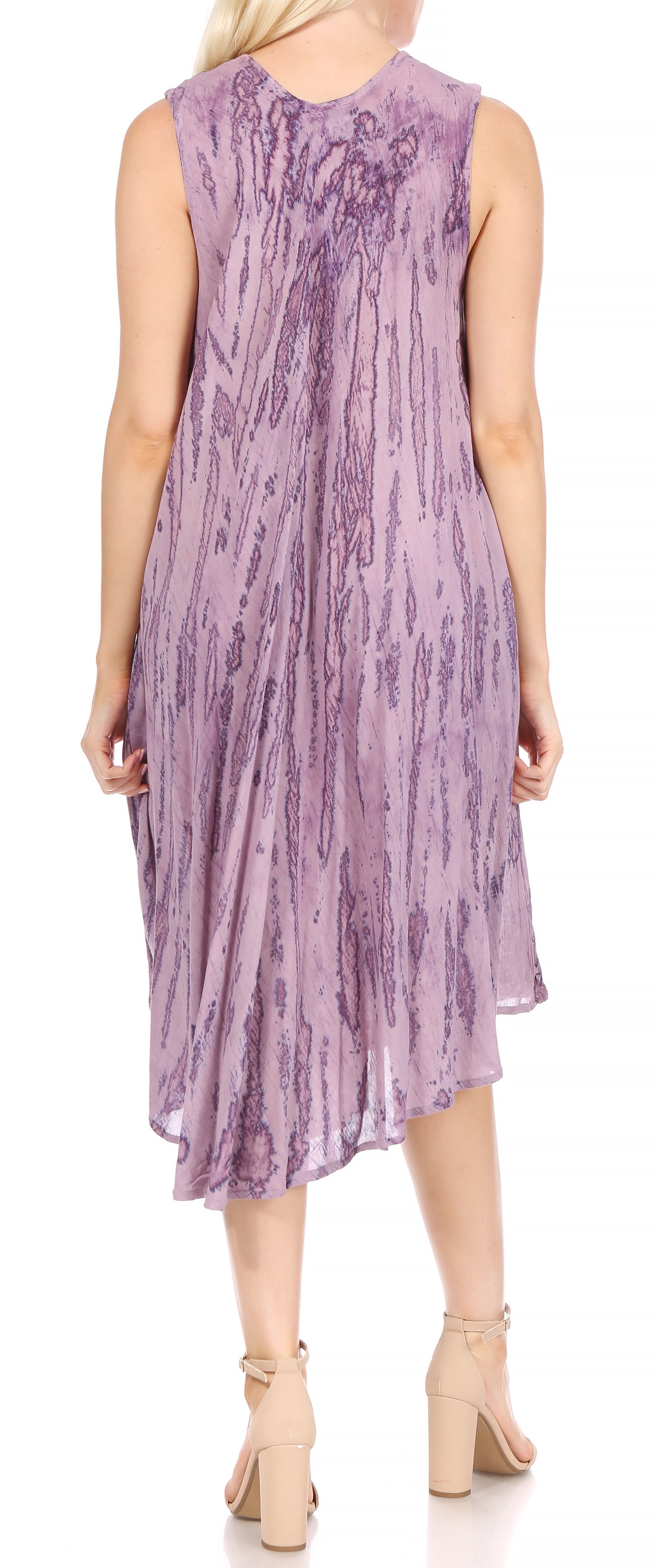Woman wearing a sleeveless purple dress with a subtle pattern on a white background