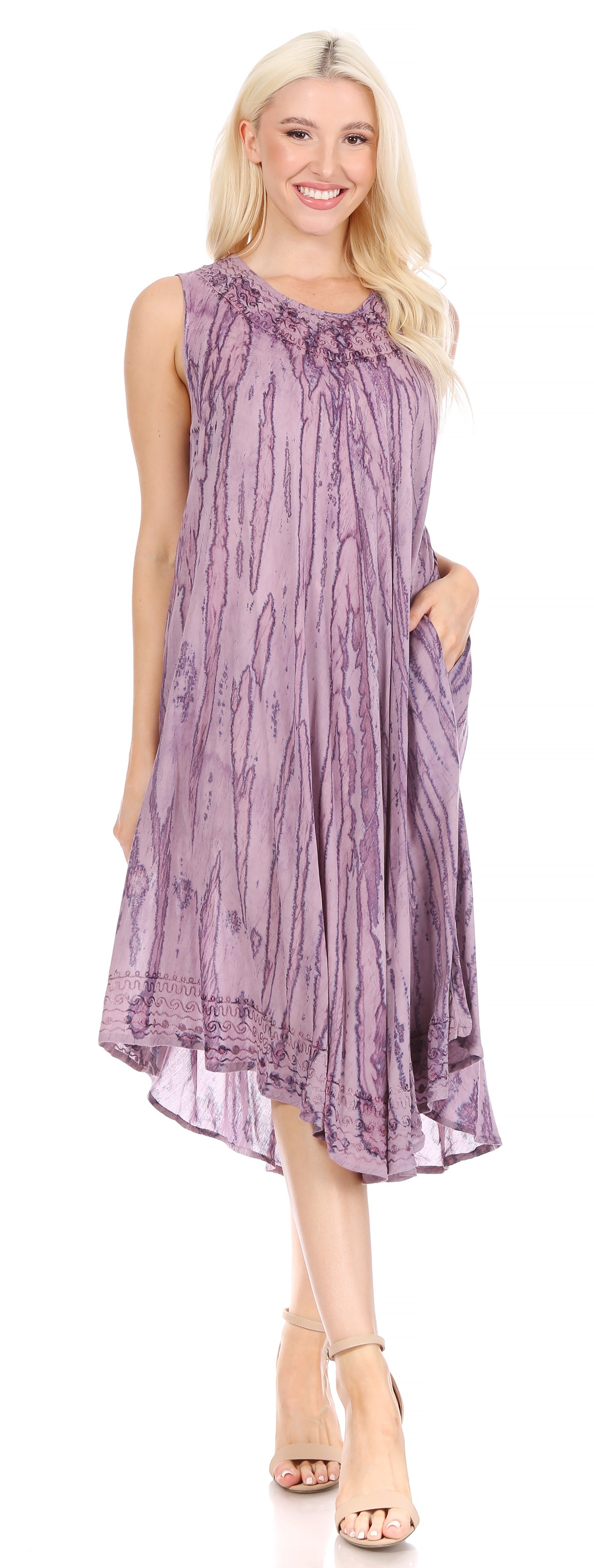 Woman wearing a purple patterned dress on a white background