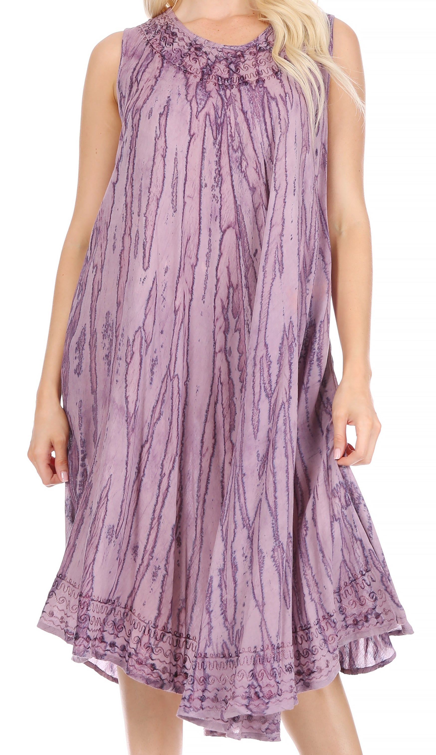 Purple patterned dress worn by a person on a white background