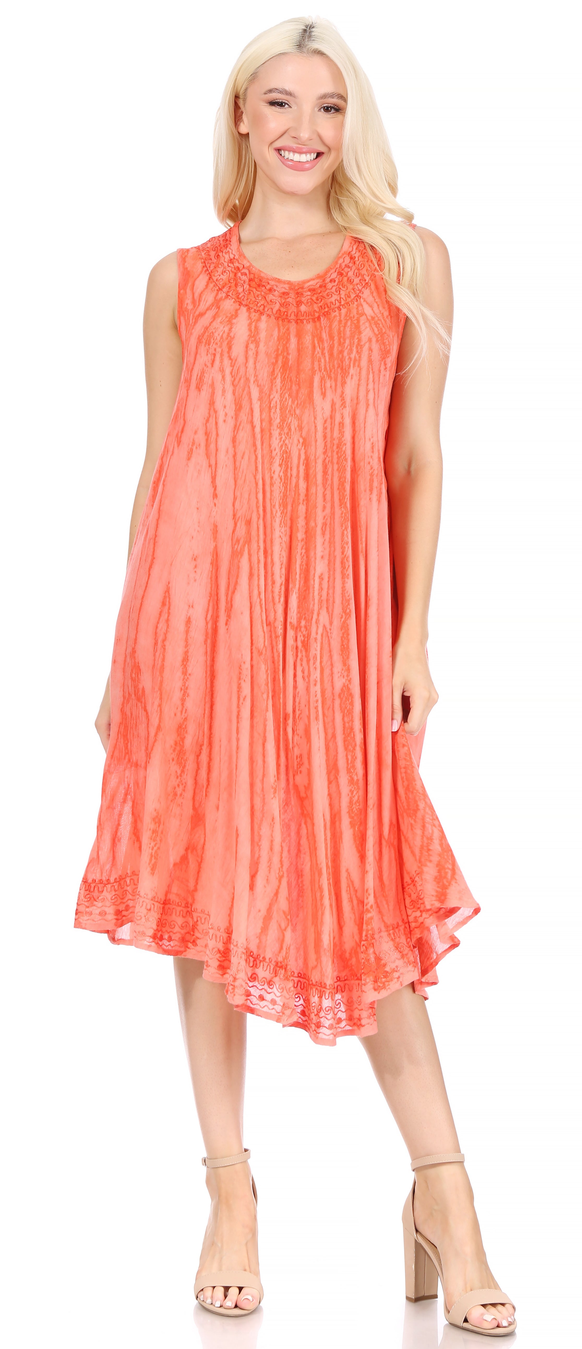 Woman wearing a coral dress on a white background