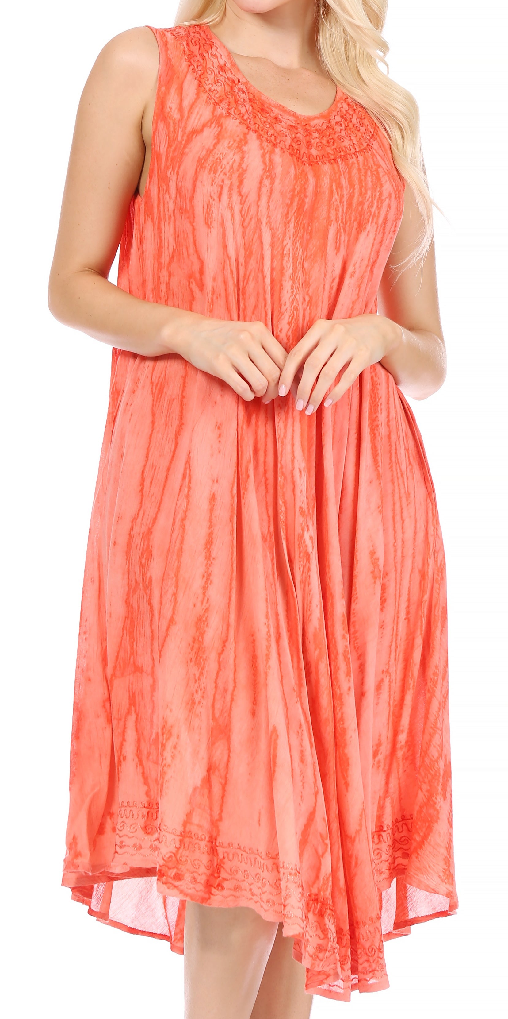 Coral dress worn by a model on a white background