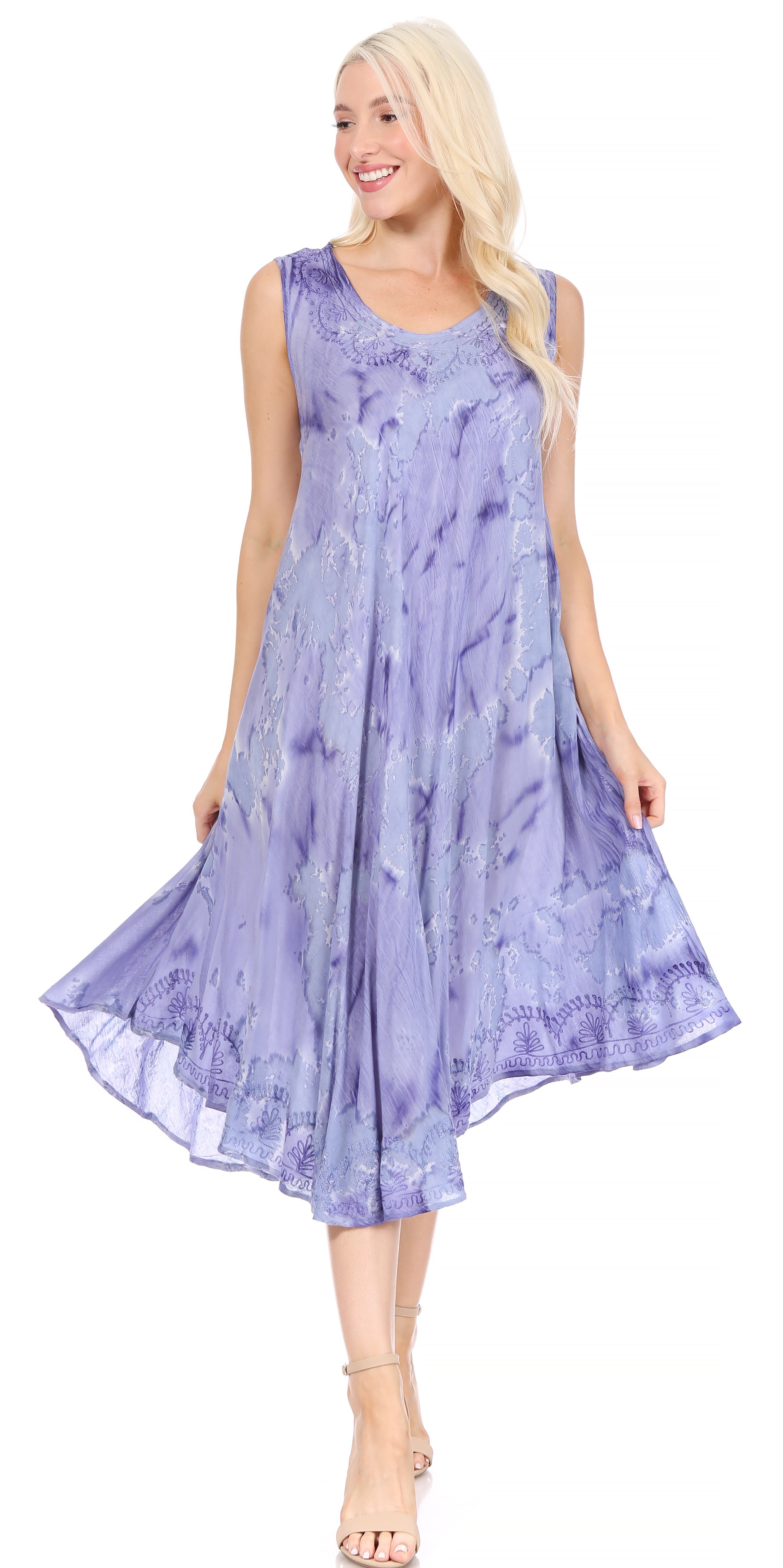 Woman wearing a sleeveless, light purple dress with lace details on a white background