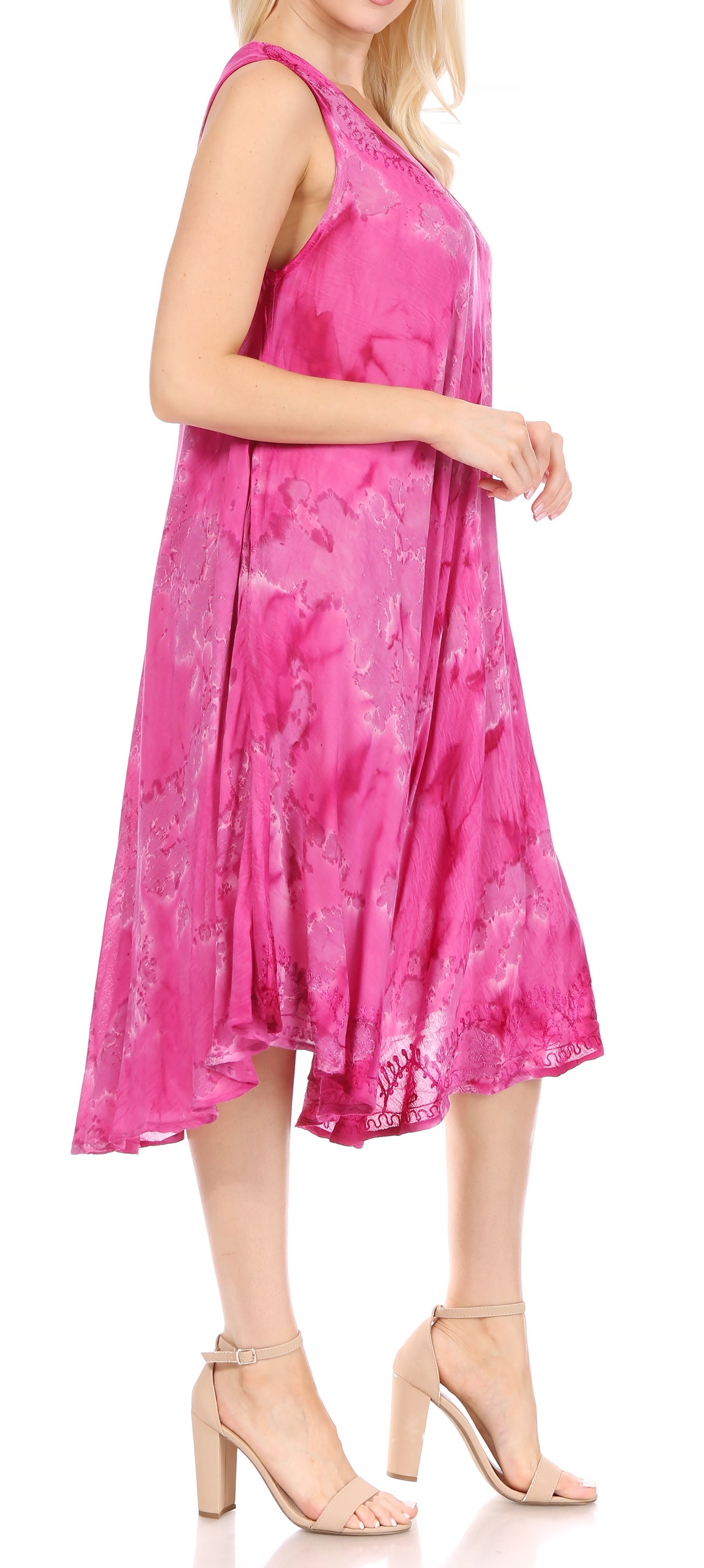 Woman wearing a pink floral dress on a white background