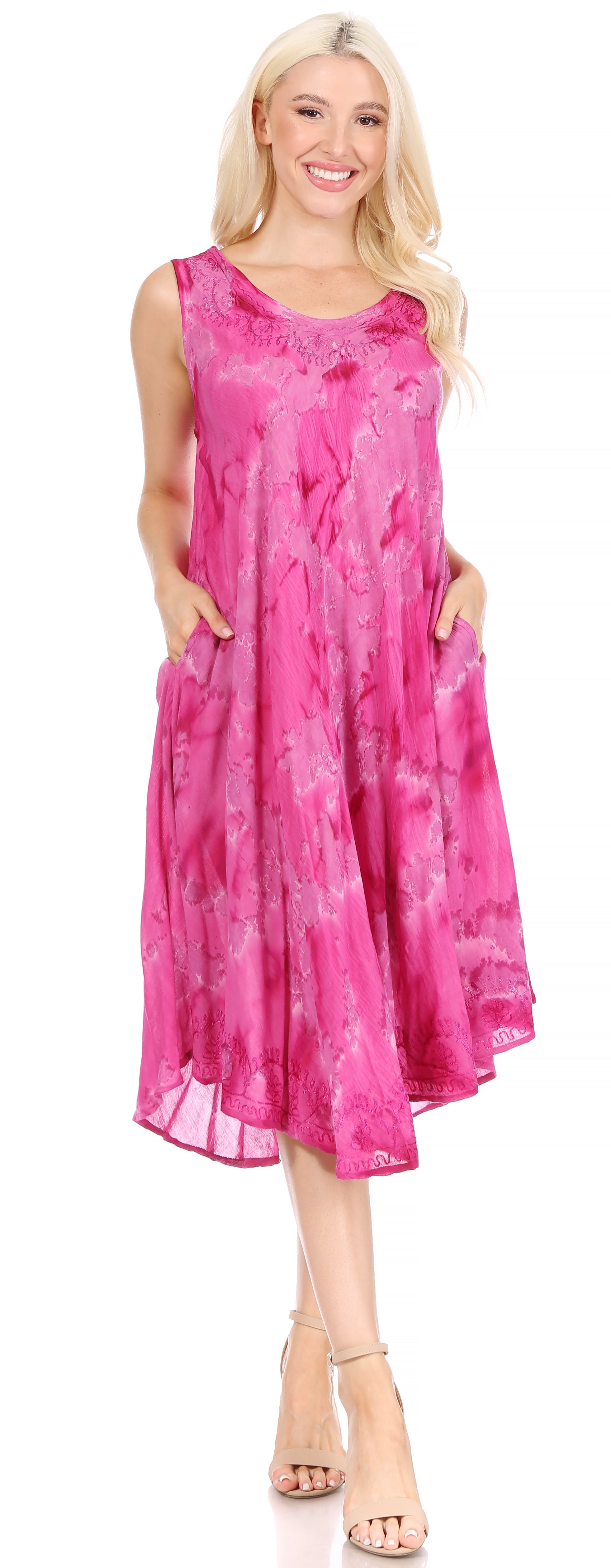 Woman wearing a pink tie-dye dress on a white background