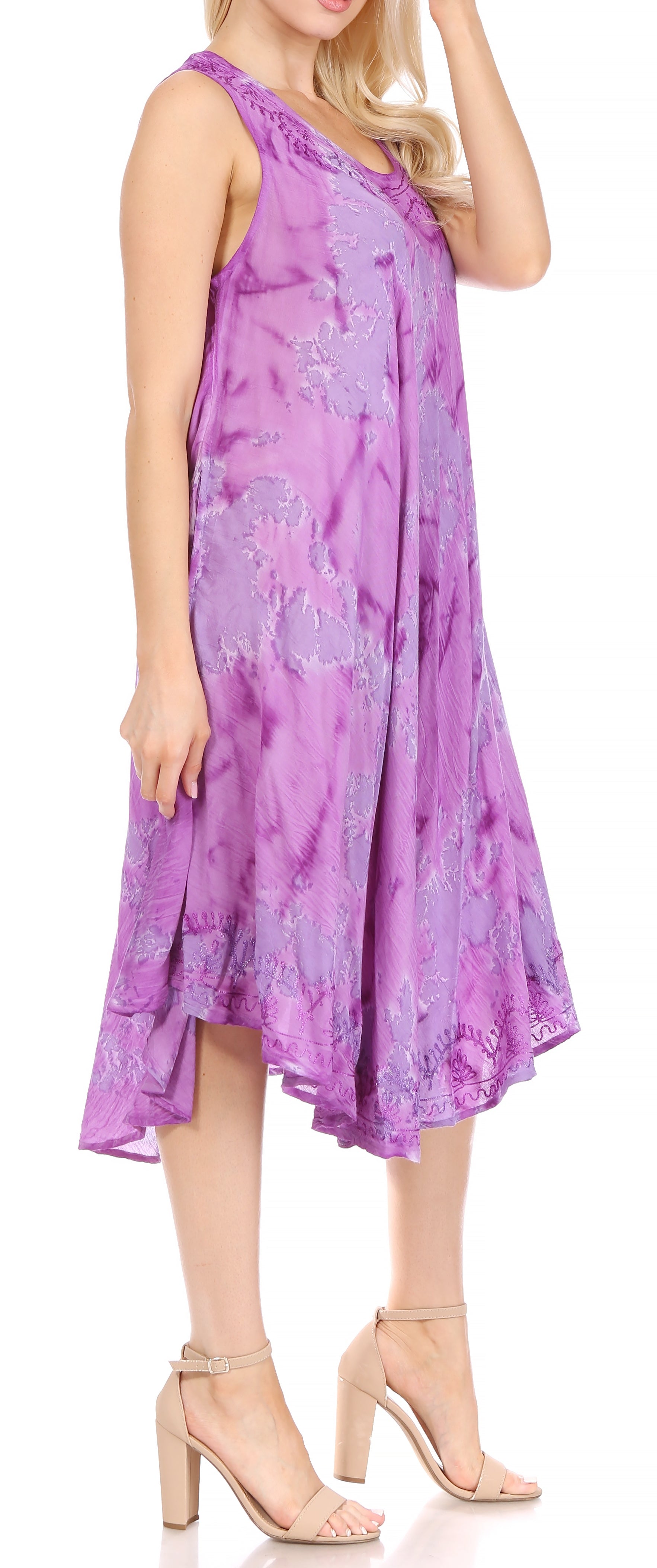 Woman wearing a purple floral dress on a white background