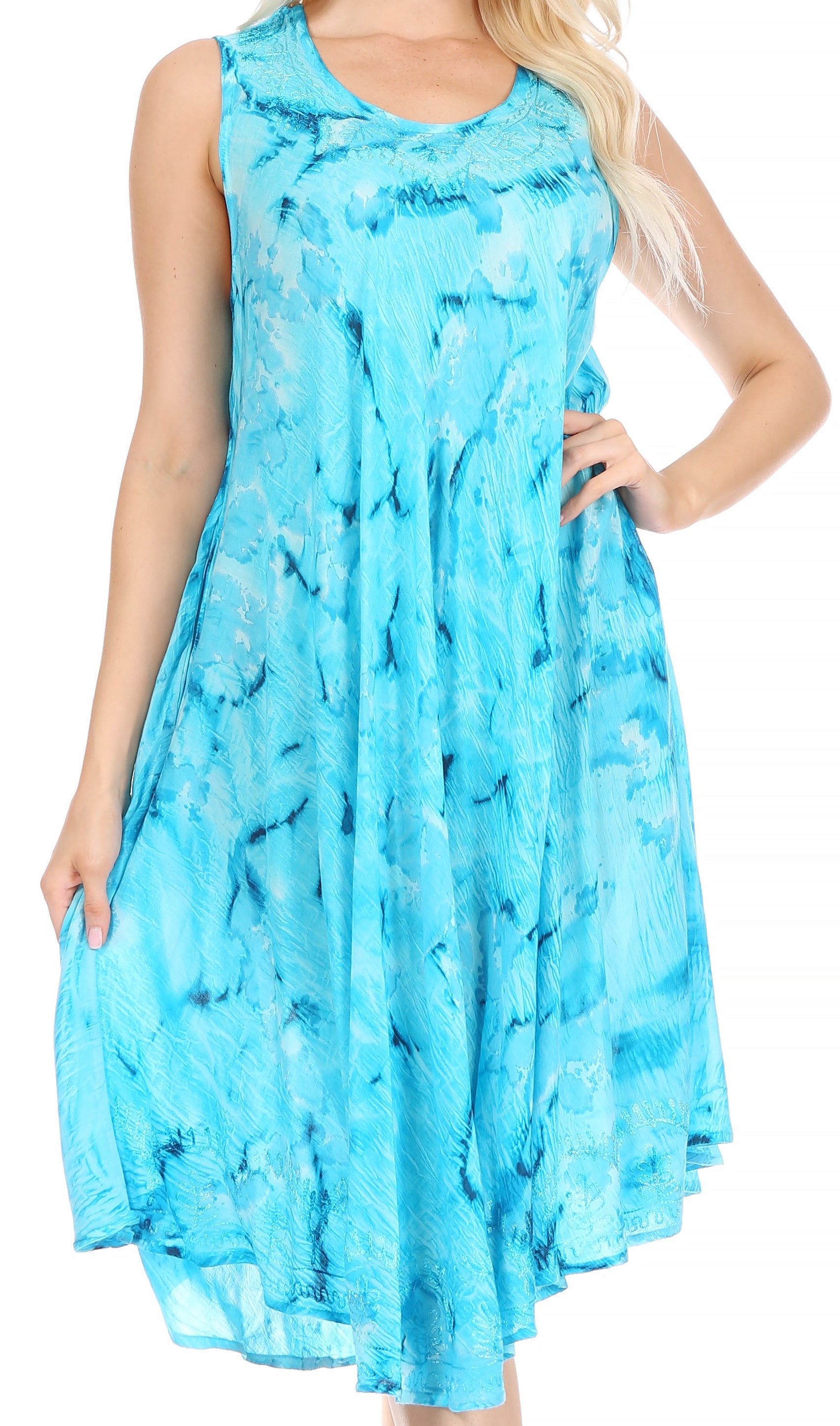 Woman wearing a blue tie-dye dress on a white background