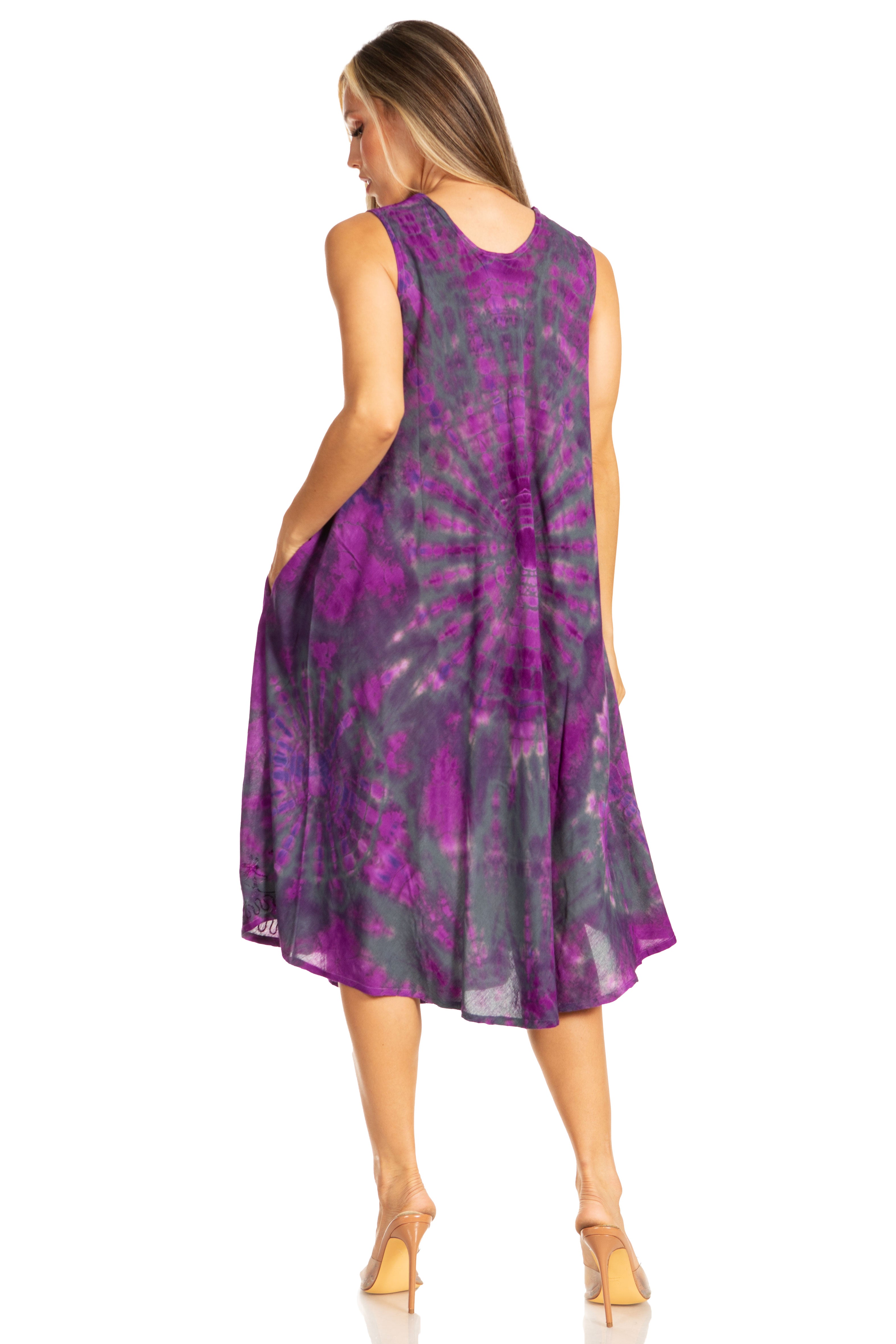 Woman wearing a purple tie-dye dress on a white background