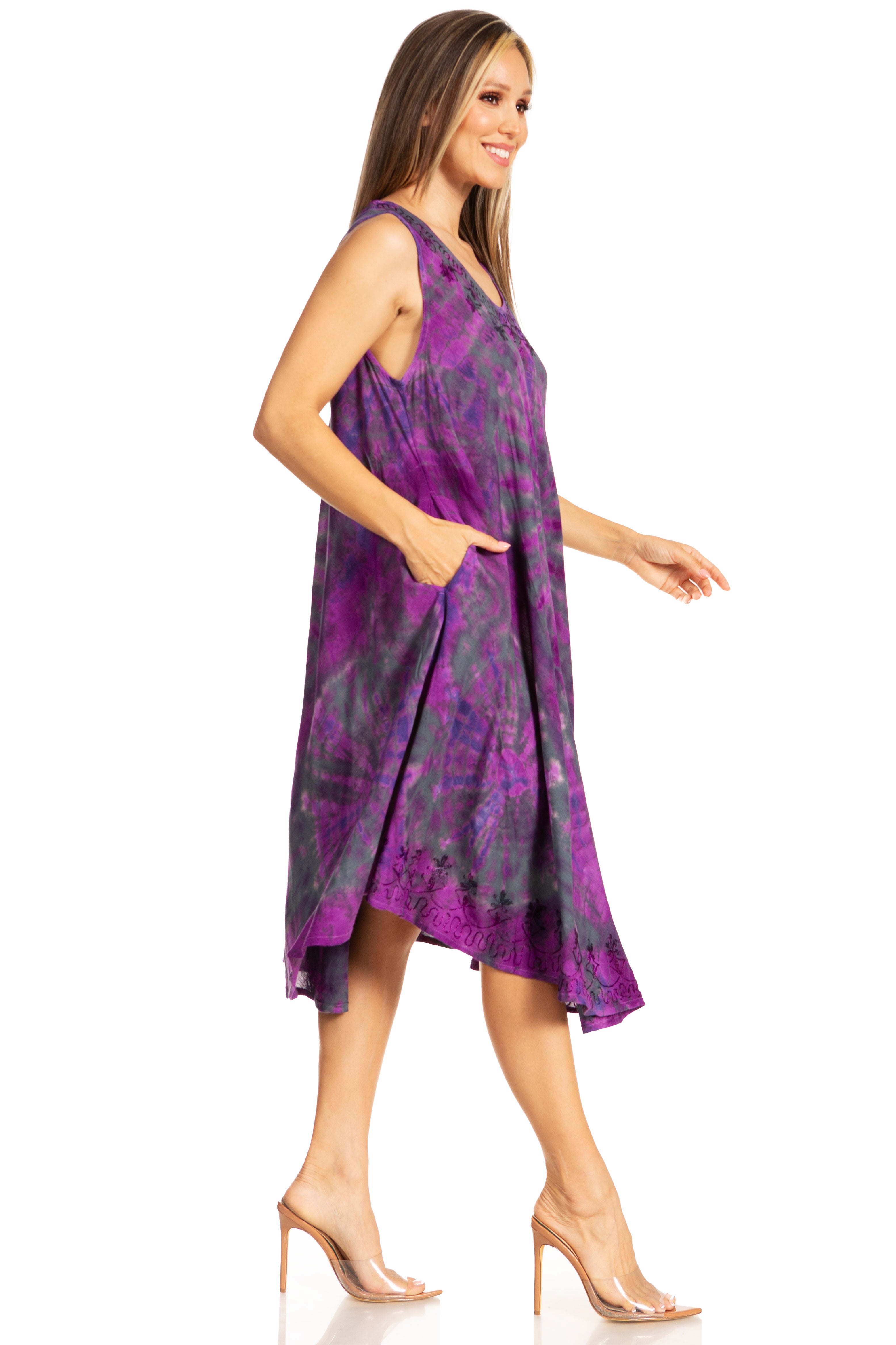 Woman wearing a purple patterned dress on a white background