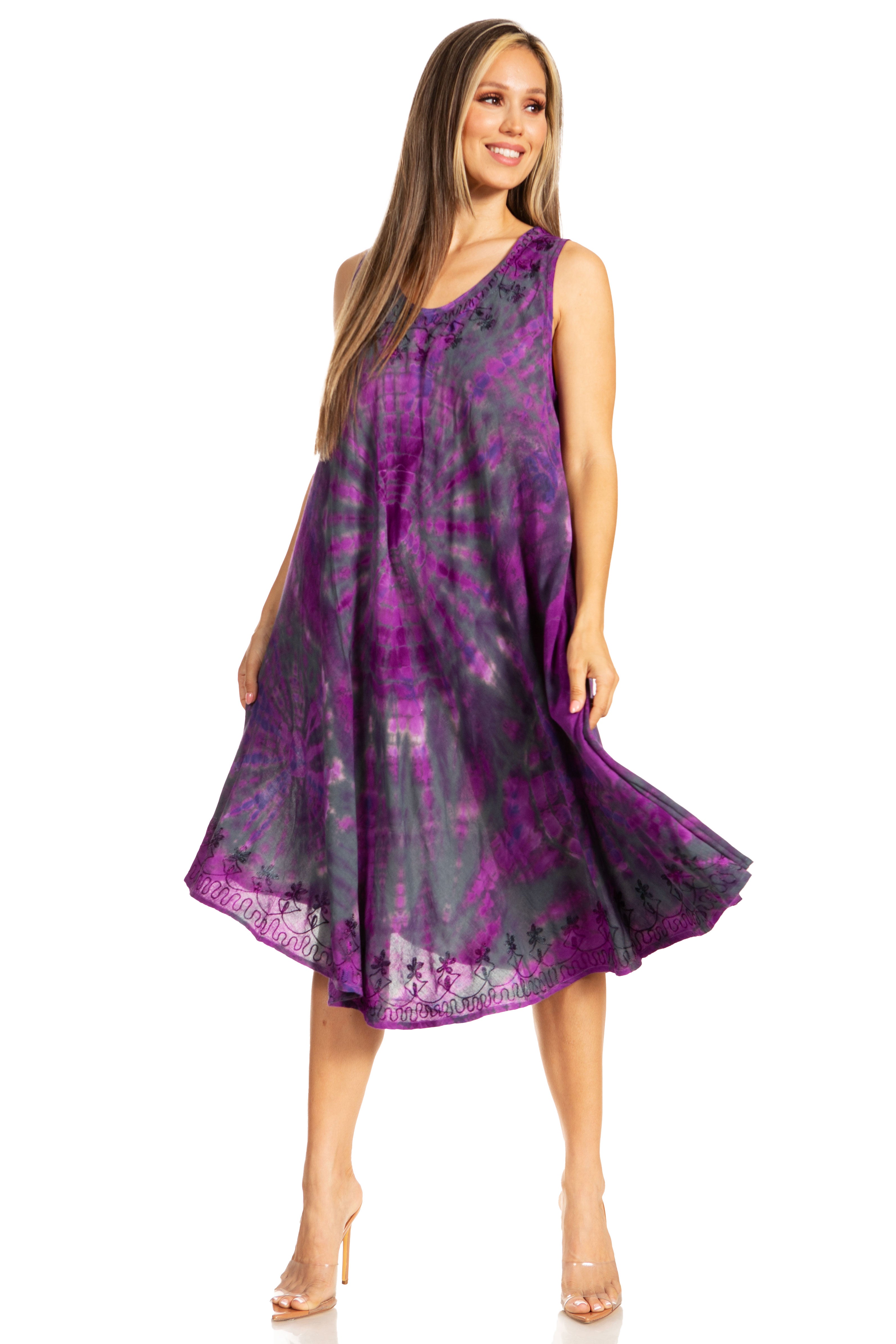 Woman wearing a purple tie-dye dress on a white background