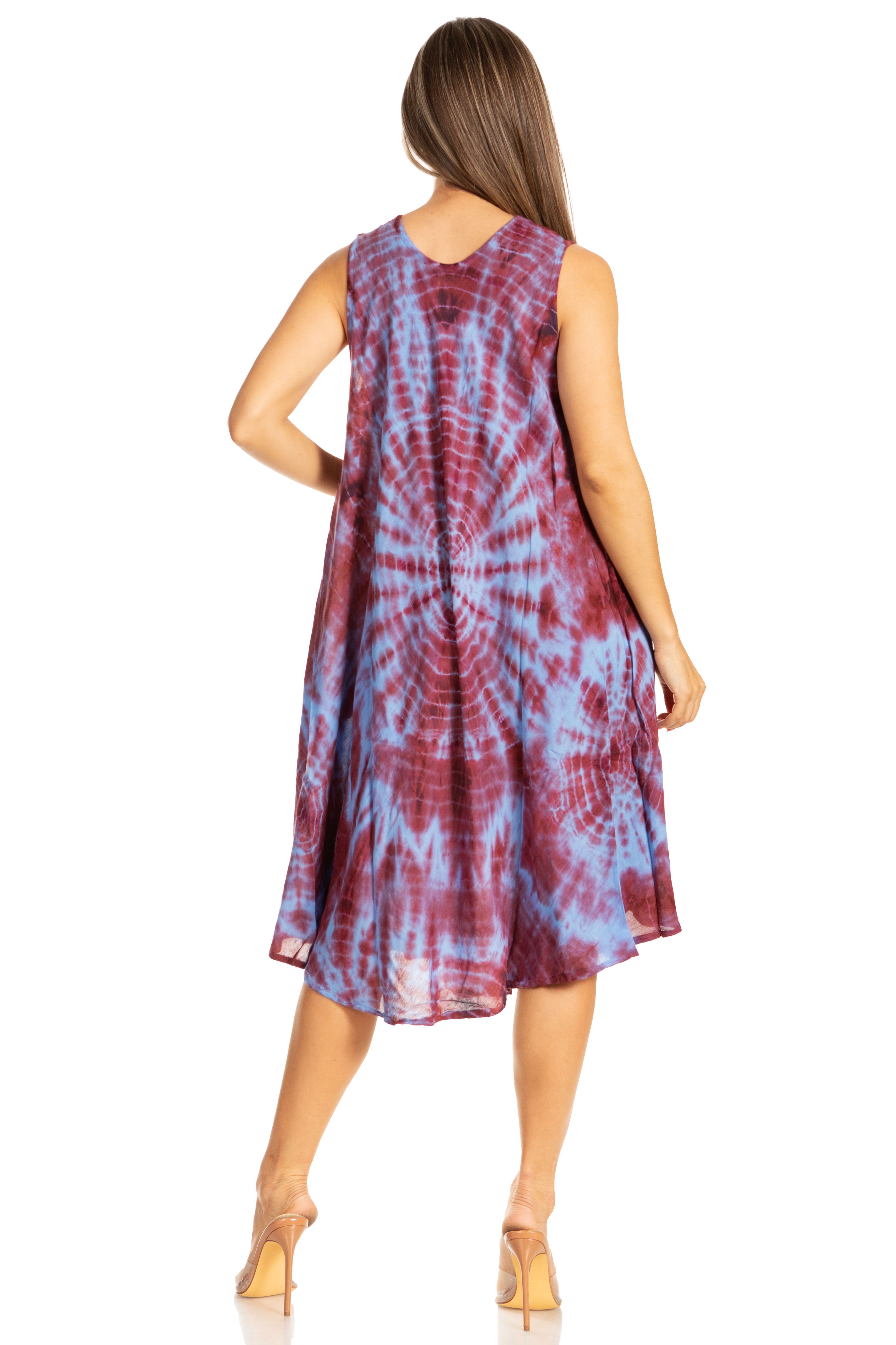 Woman wearing a tie-dye dress on a white background