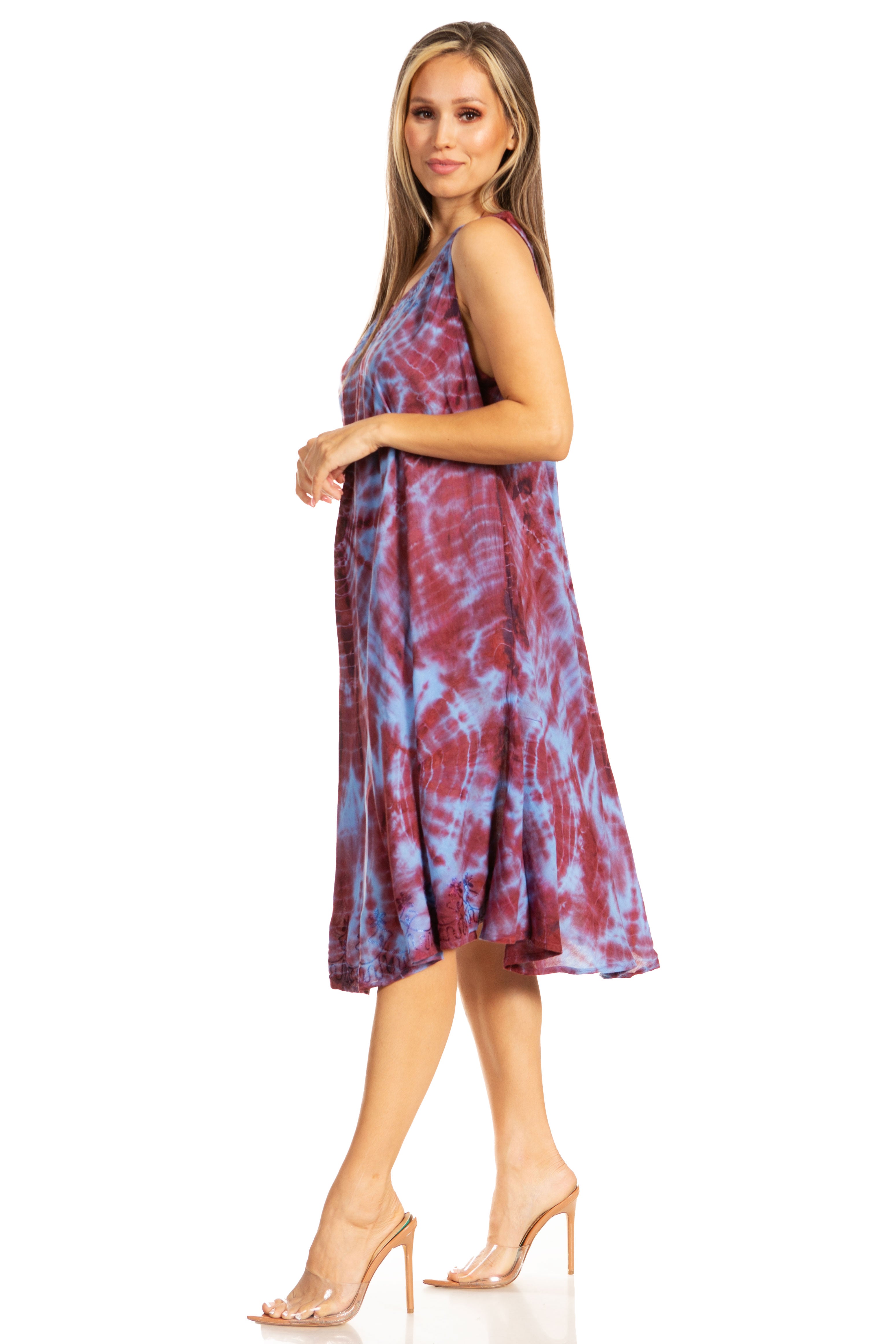 Woman wearing a tie-dye dress on a white background