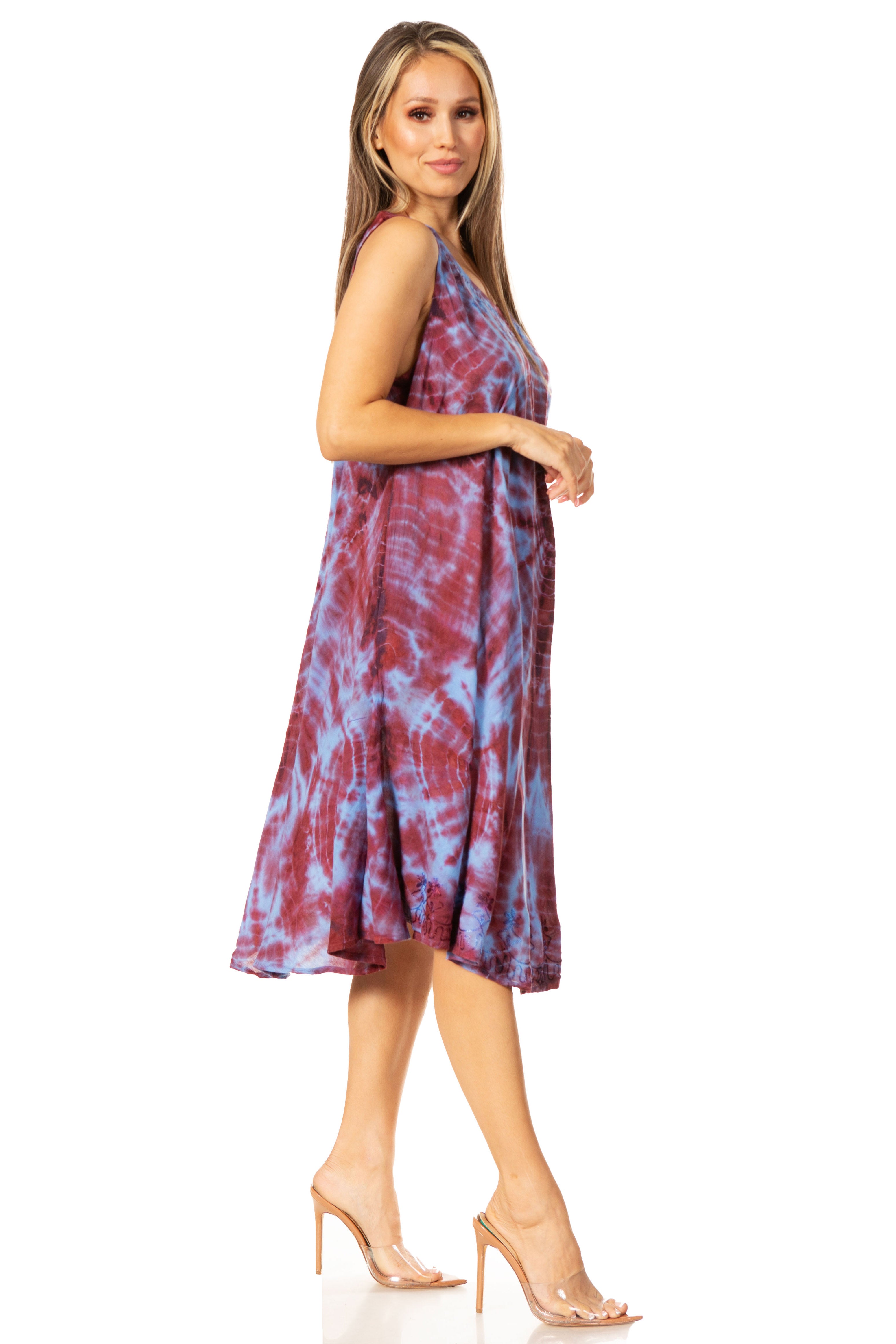 Woman wearing a tie-dye dress on a white background