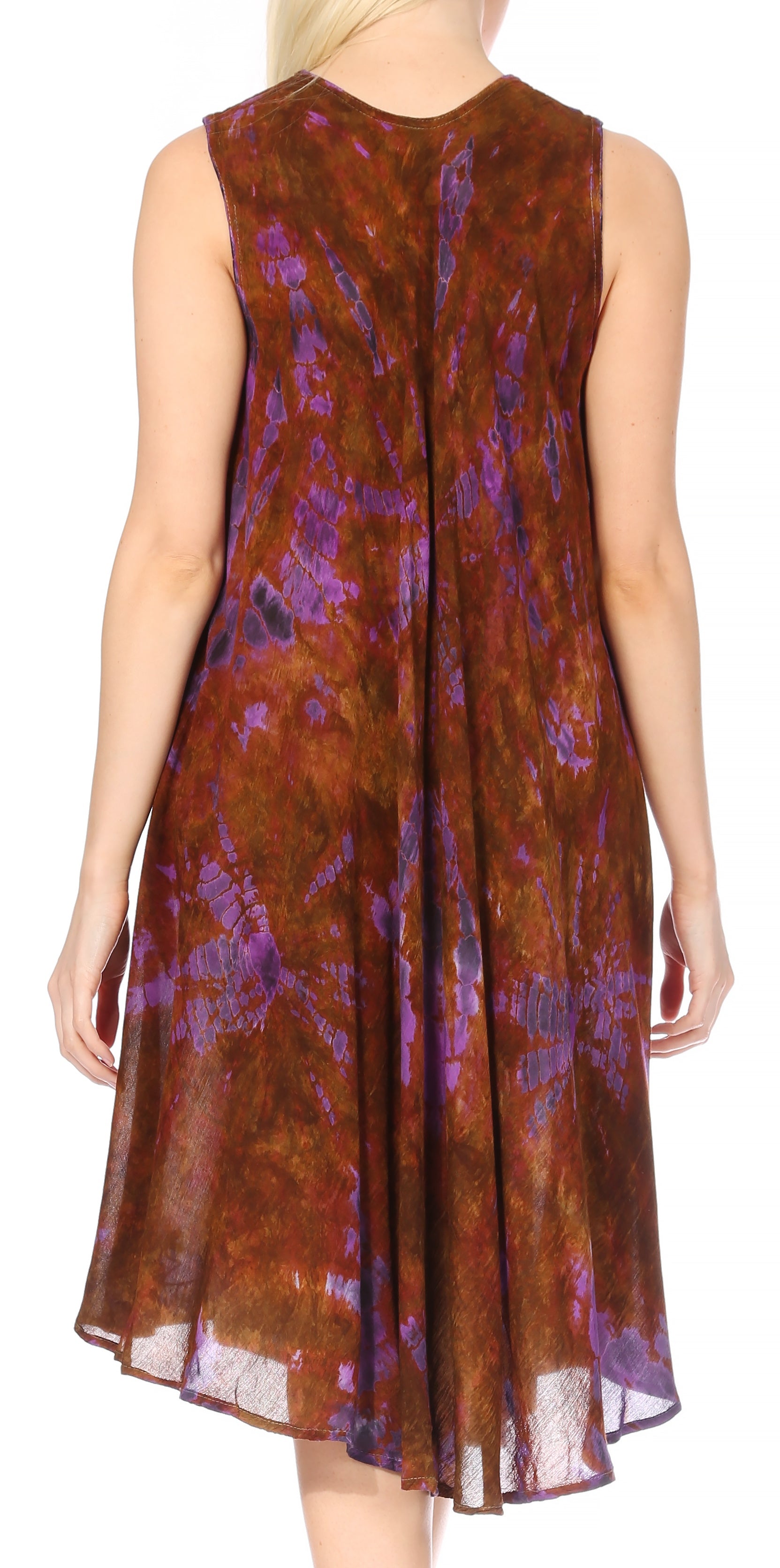 Woman wearing a sleeveless dress with a pattern of brown, purple, and pink on a white background