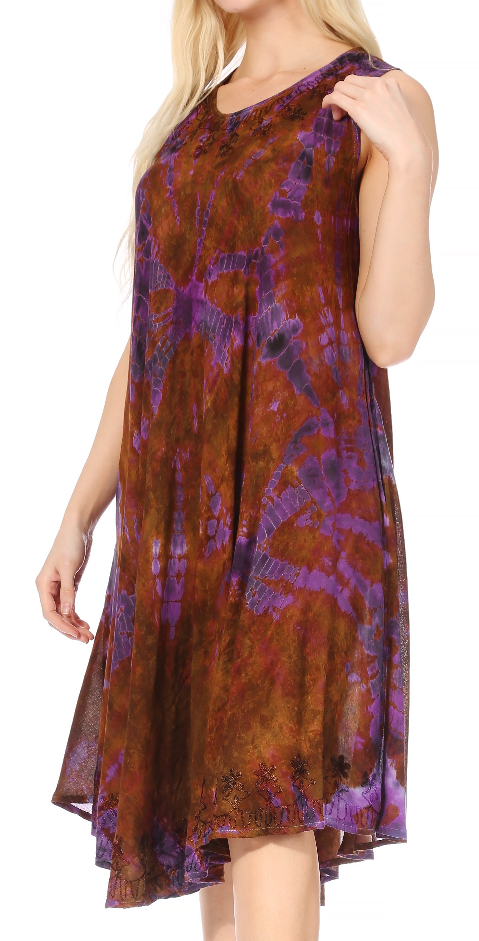 Woman wearing a sleeveless dress with a brown and purple tie-dye pattern on a white background