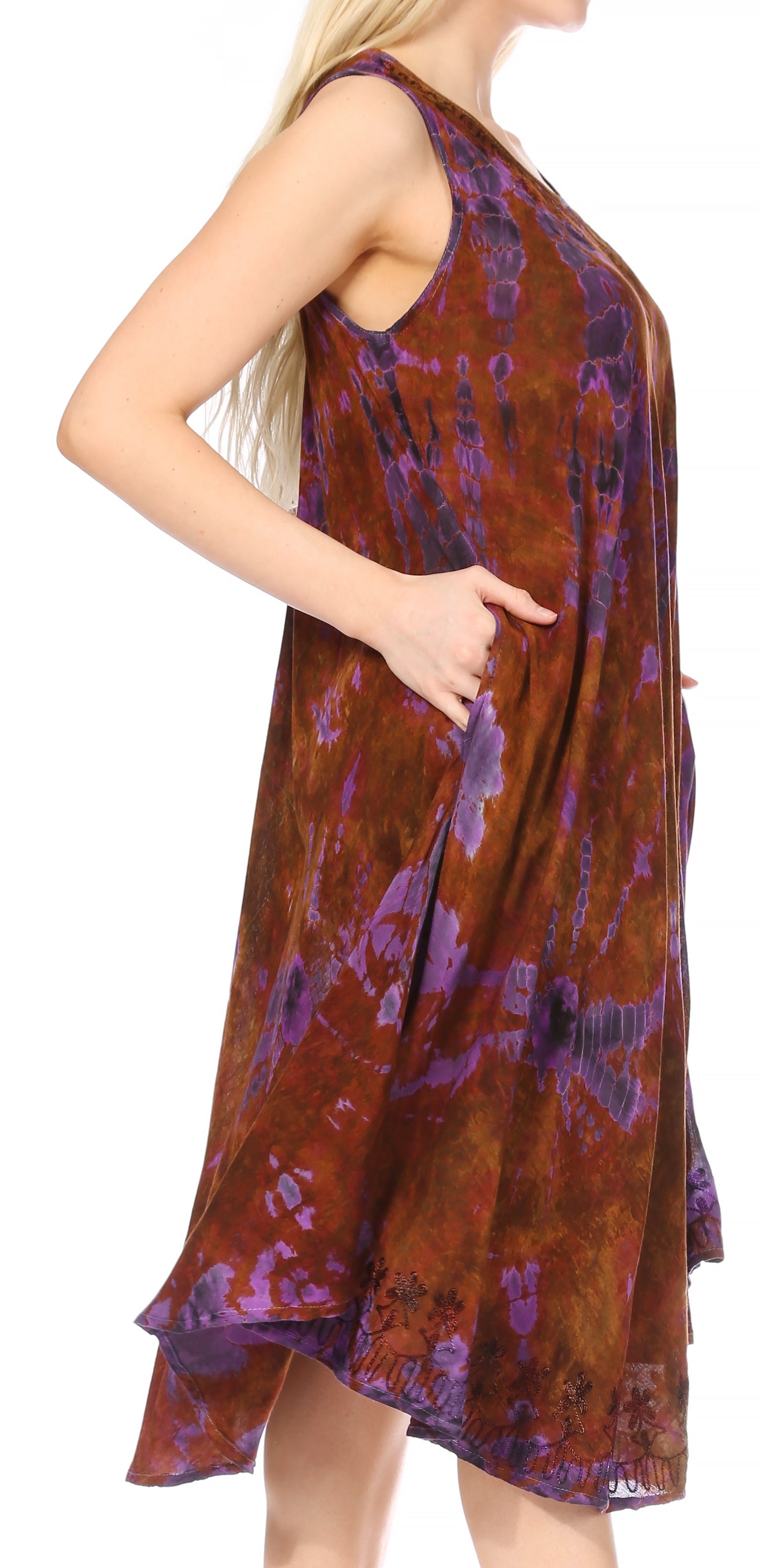 Woman wearing a patterned dress with a white background