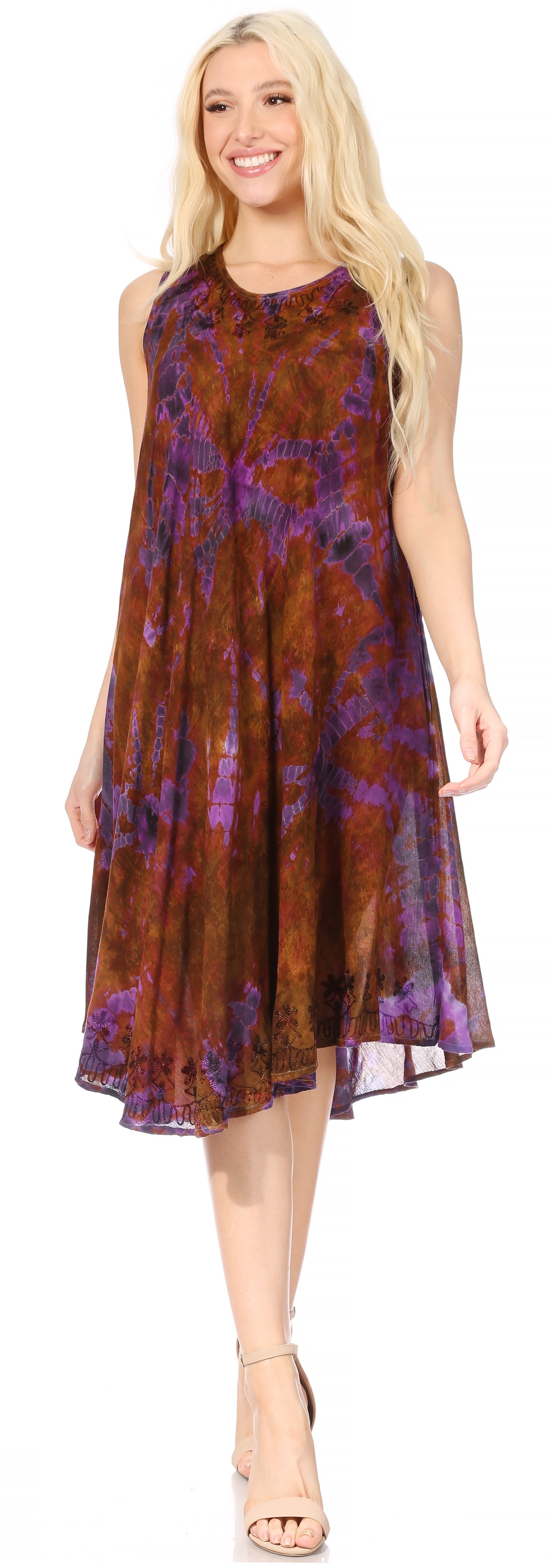 Woman wearing a sleeveless dress with a floral pattern on a plain background
