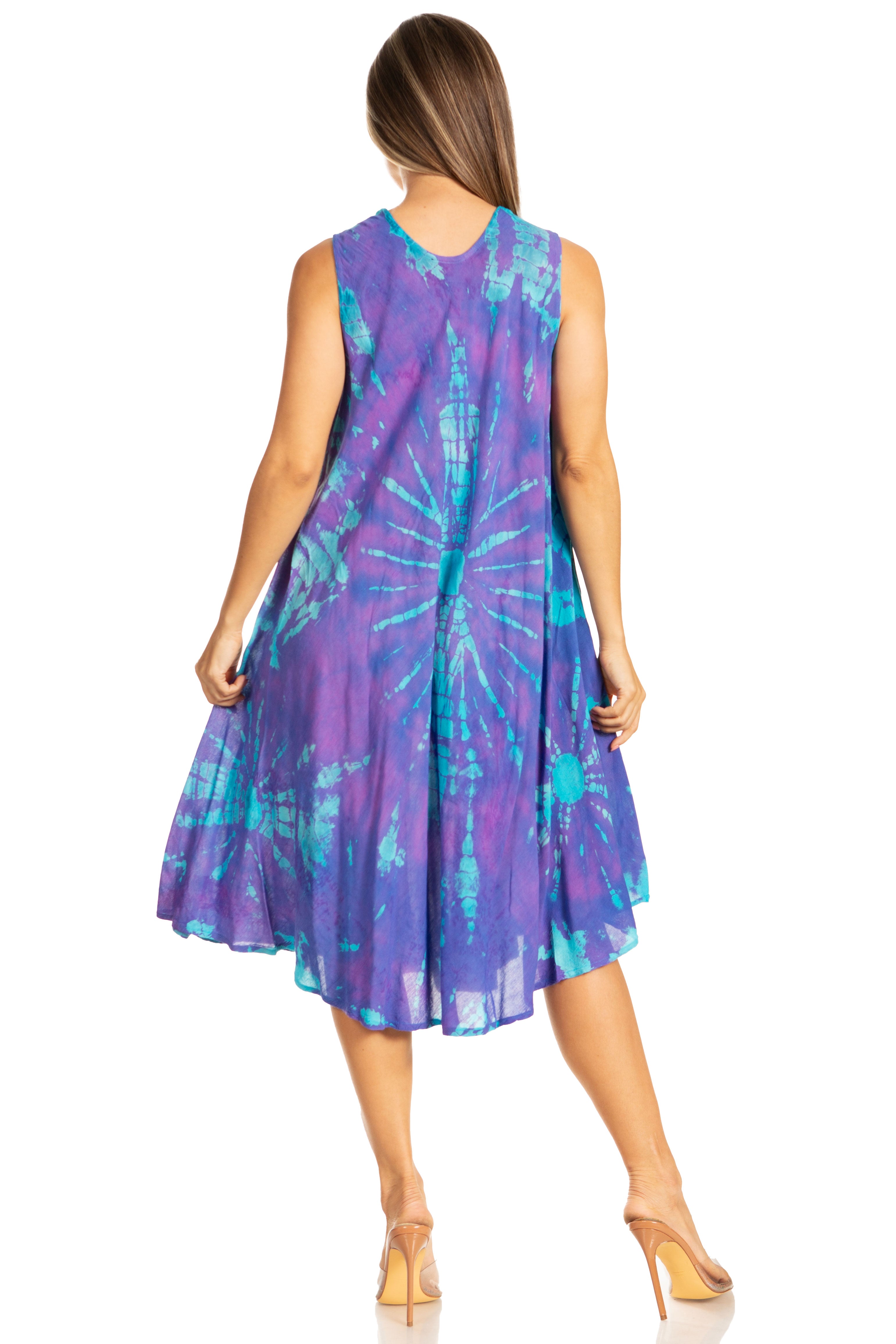 Woman wearing a sleeveless purple and blue tie-dye dress on a white background