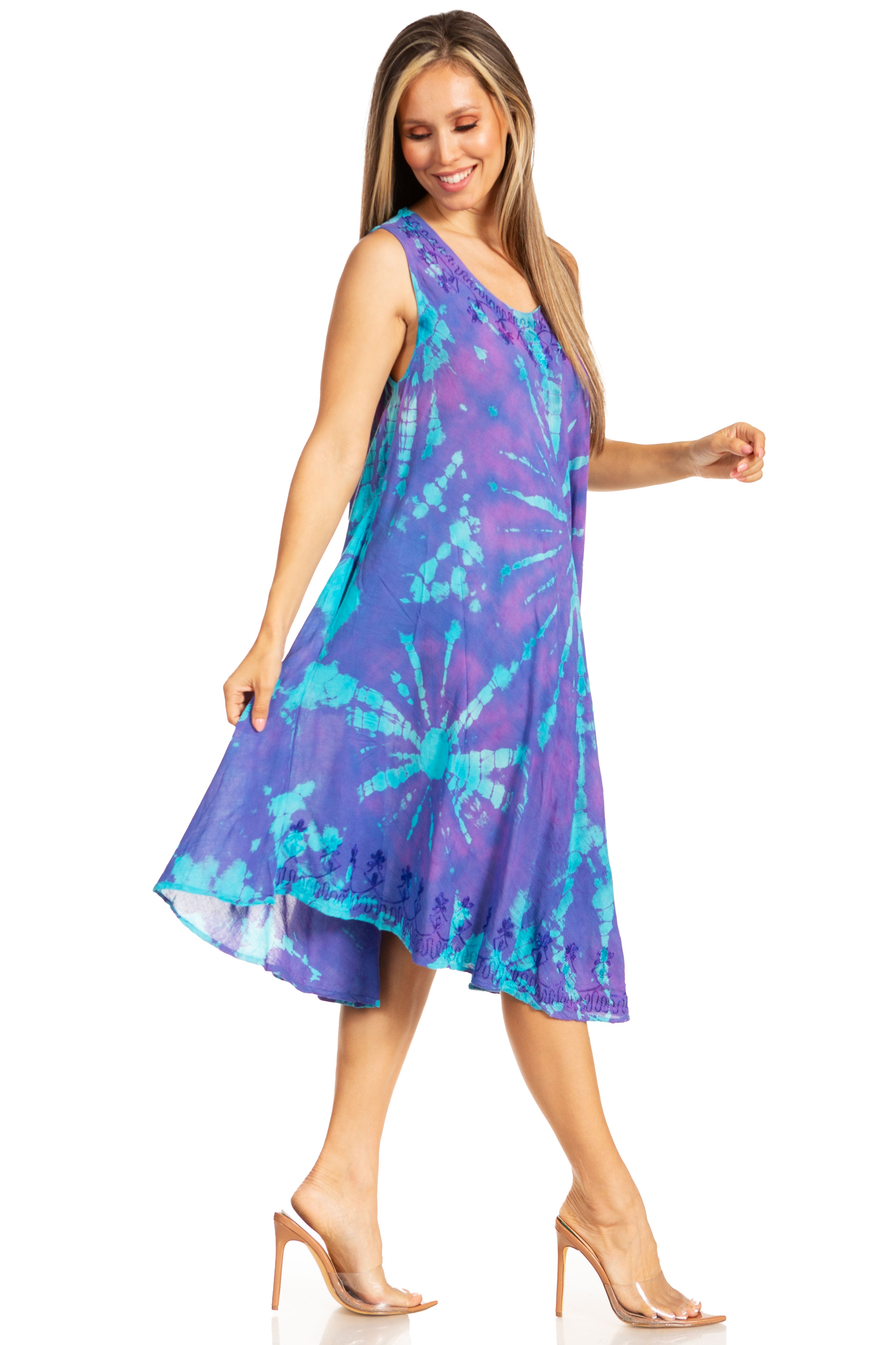 Woman wearing a purple and blue tie-dye dress on a white background